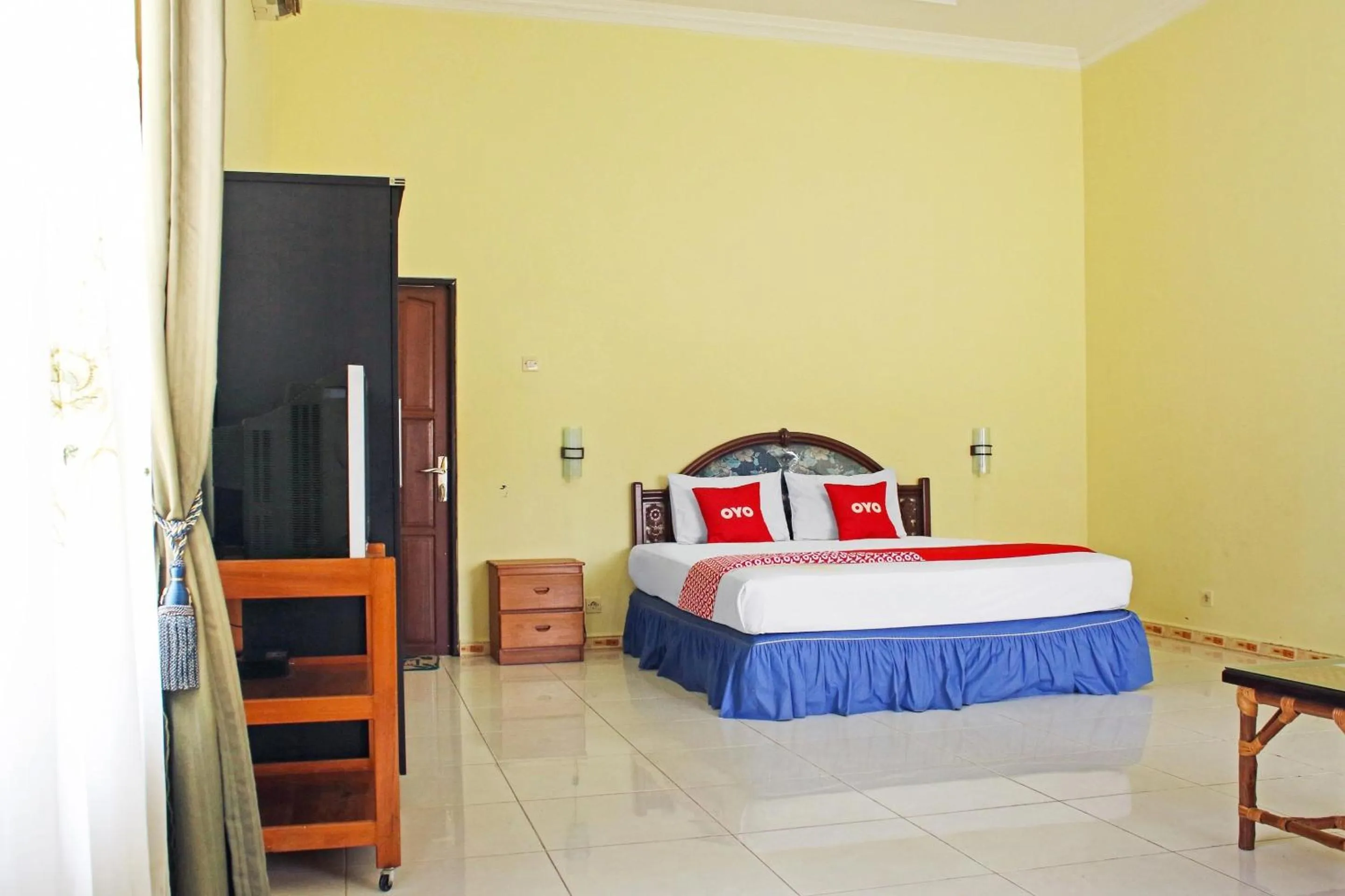 Bedroom in Hotel O Aman