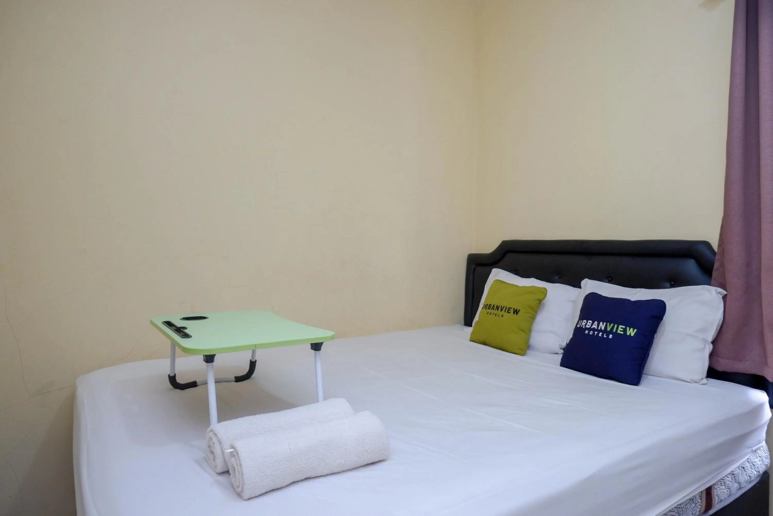 Bedroom, Bed in Urbanview Hotel Jogja City Mall