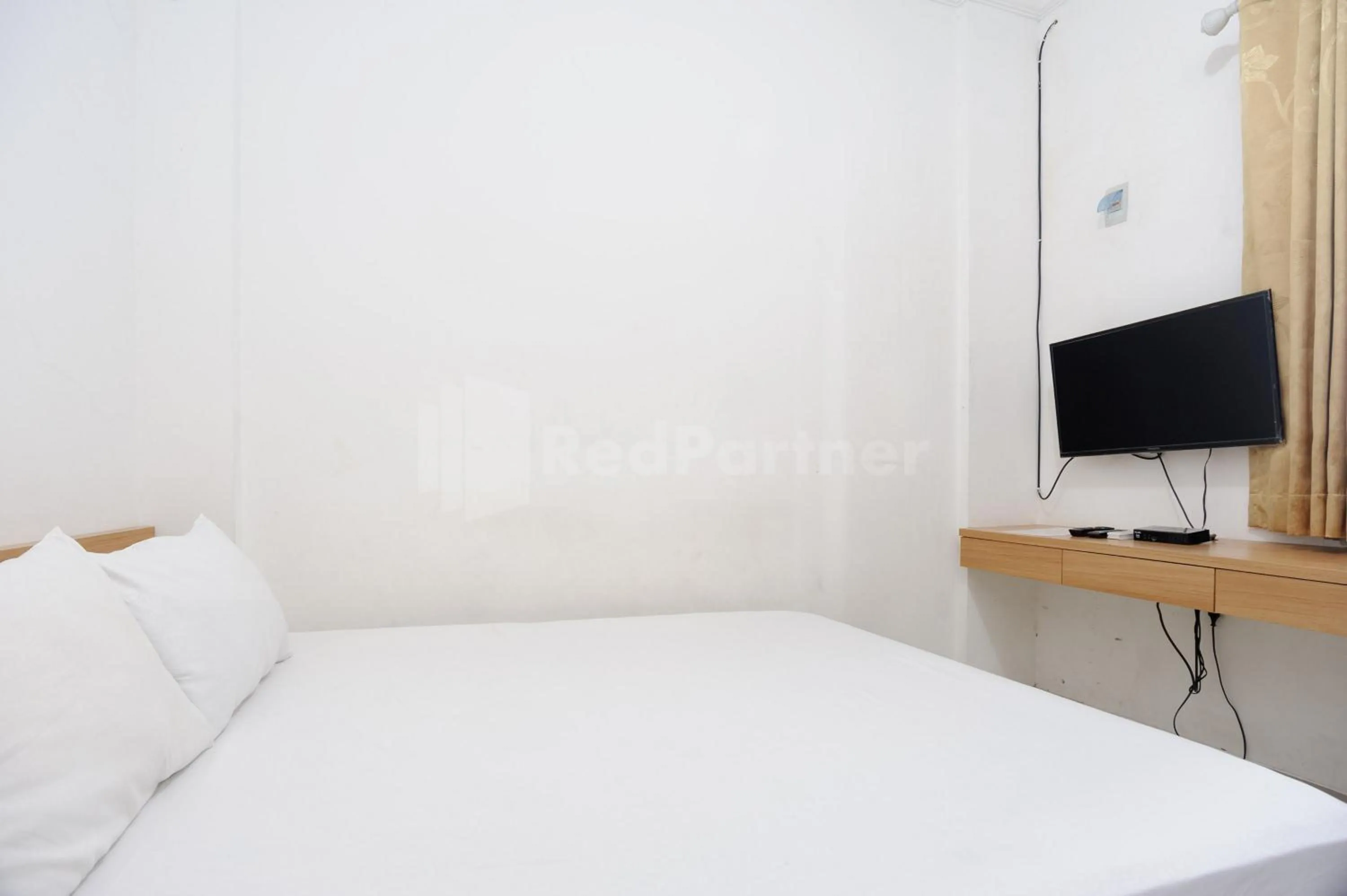 Bed in Family Residence Mitra RedDoorz