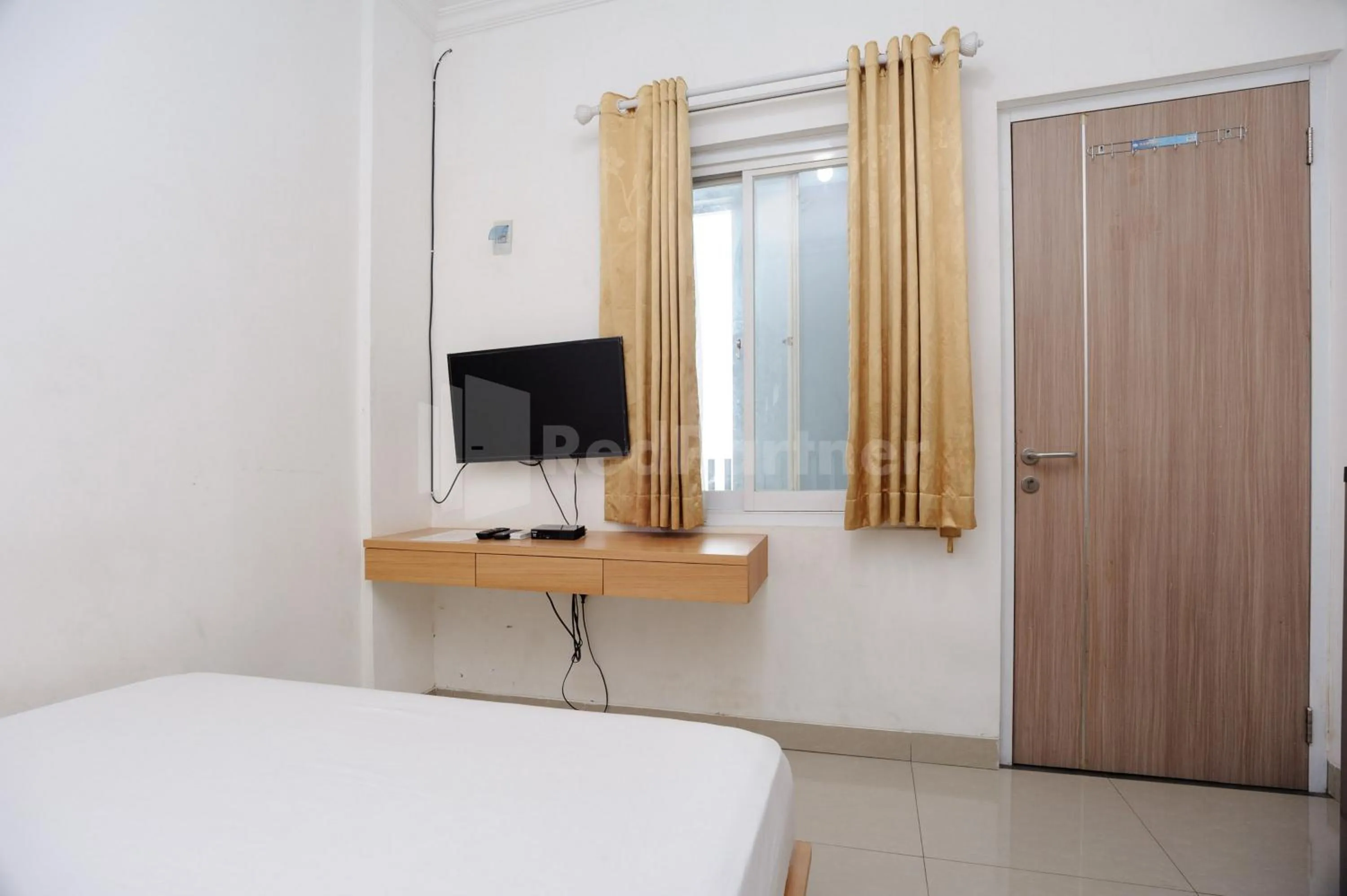 Bed in Family Residence Mitra RedDoorz