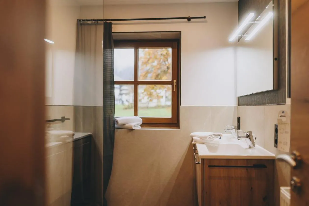 Bathroom in Hotel Gasthof Mitteregger - BEST PLACE in town with summercard included