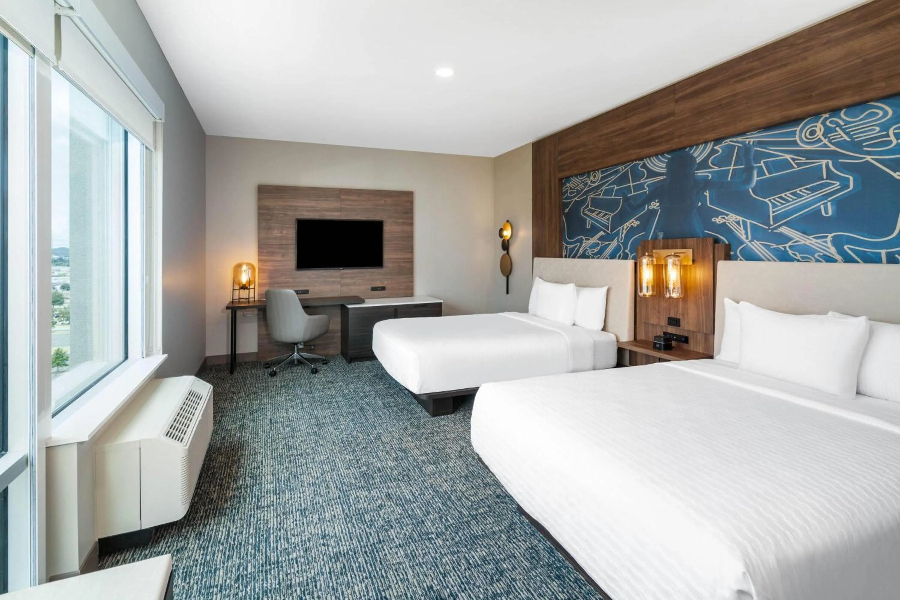 Photo of the whole room, Bed in La Quinta Inn & Suites by Wyndham Nashville Downtown Stadium