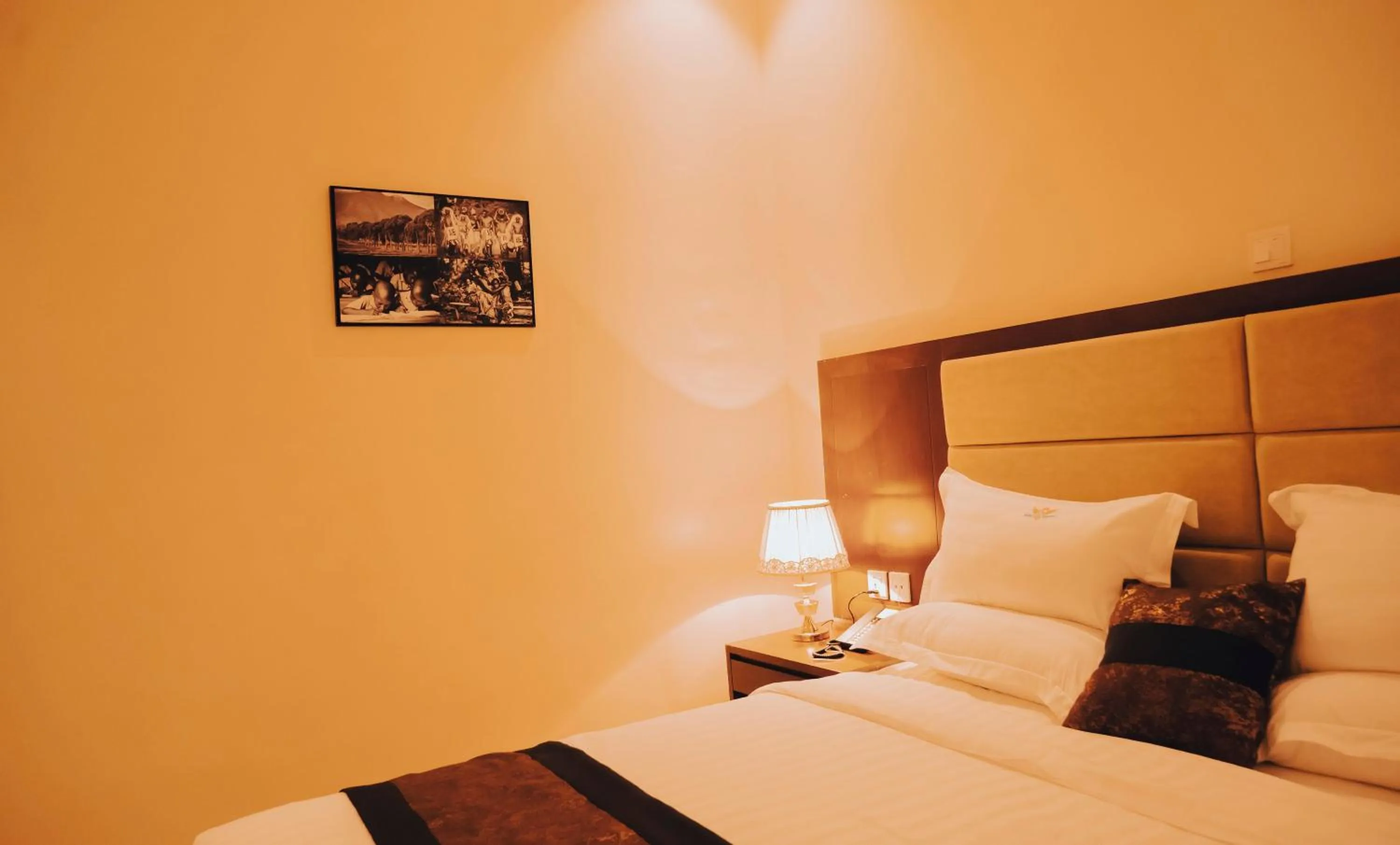 Bed in Madras Hotel and Apartments