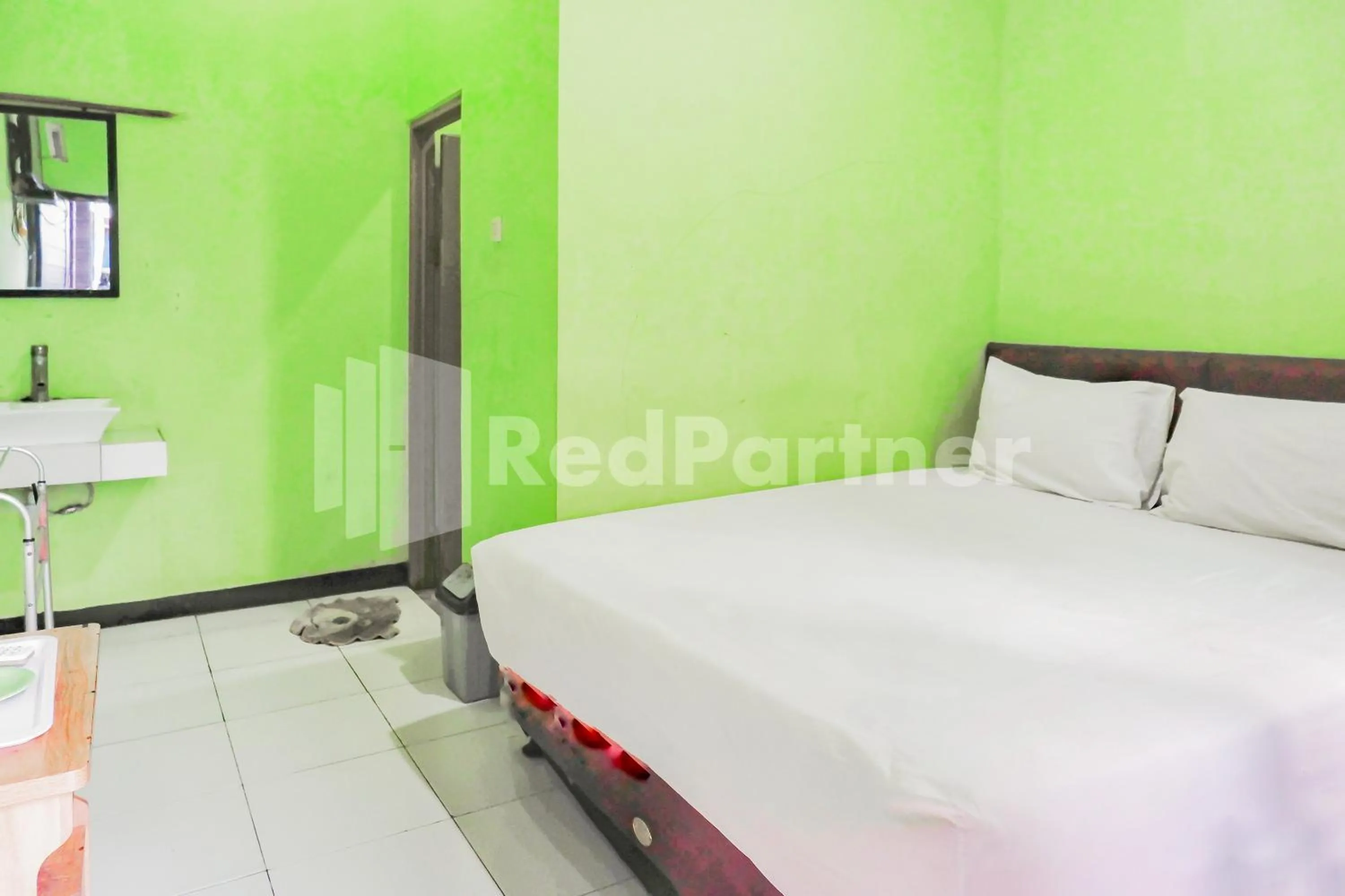 Bedroom, Bed in Indah Savana Hotel Mitra RedDoorz