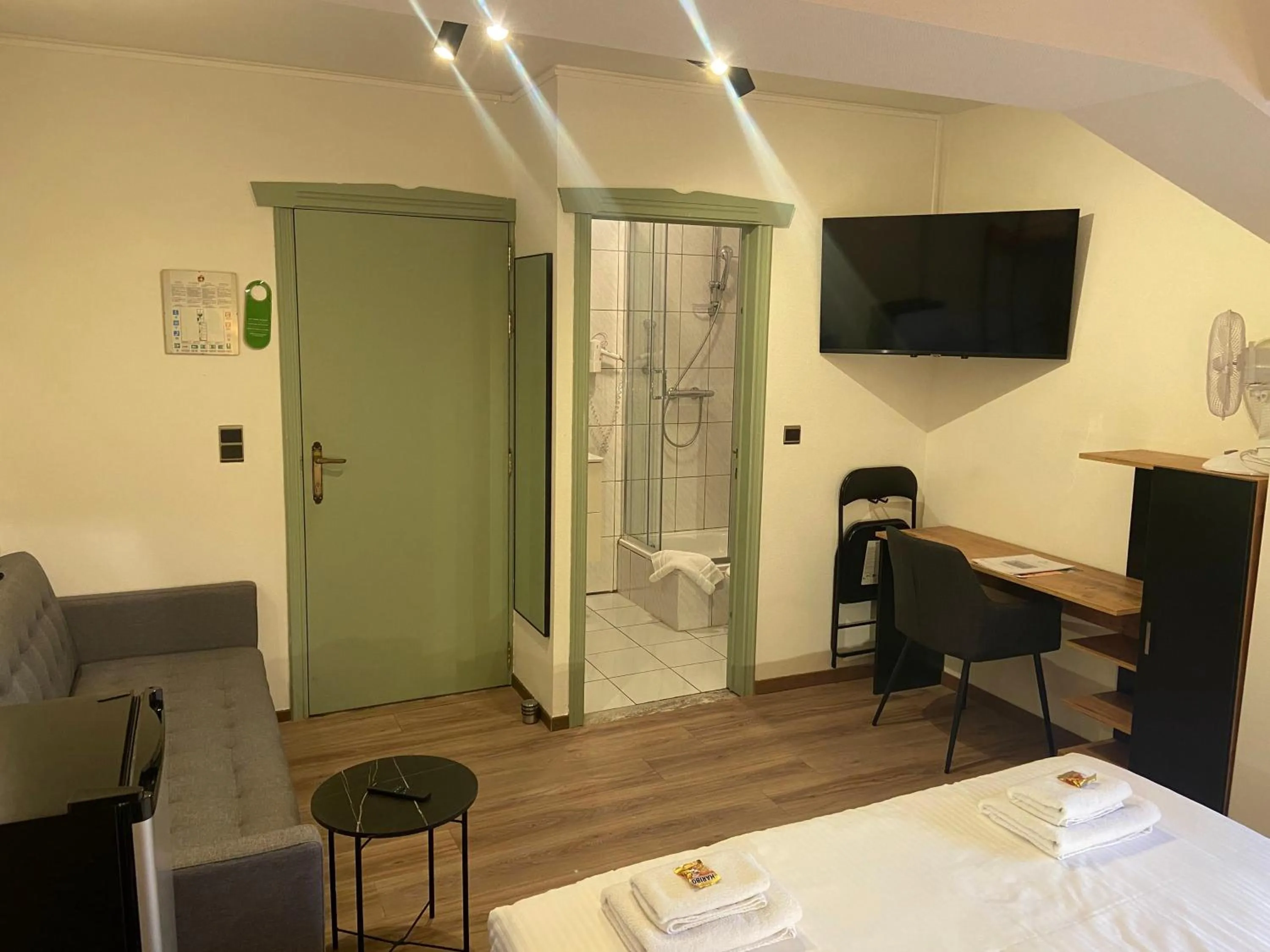 Seating area, Bed in Hotel Monika