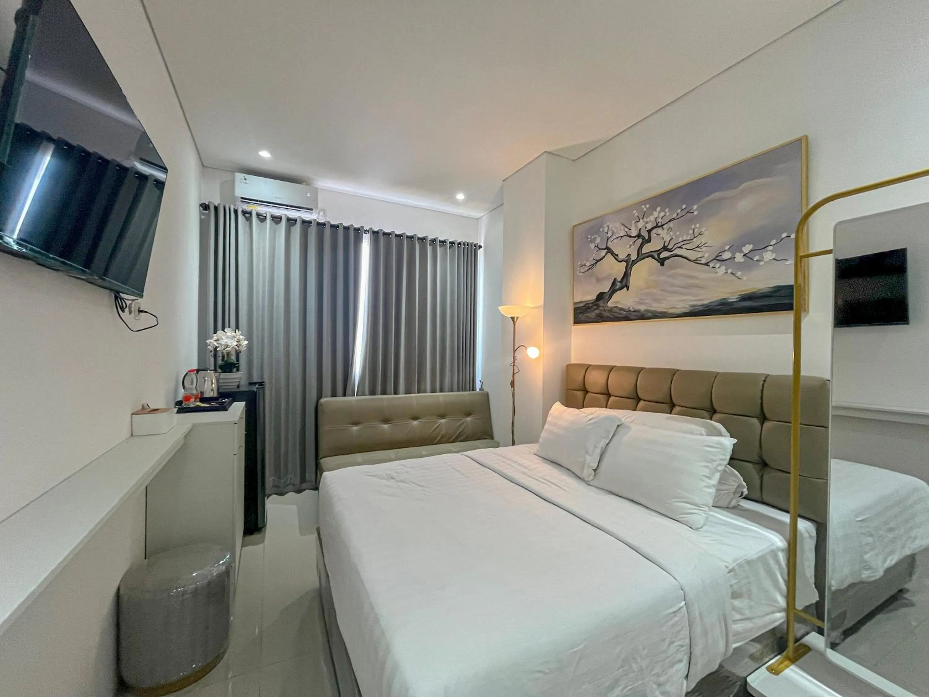 Bathroom, Bed in Graha Socio Hotel Nusa Dua Bali