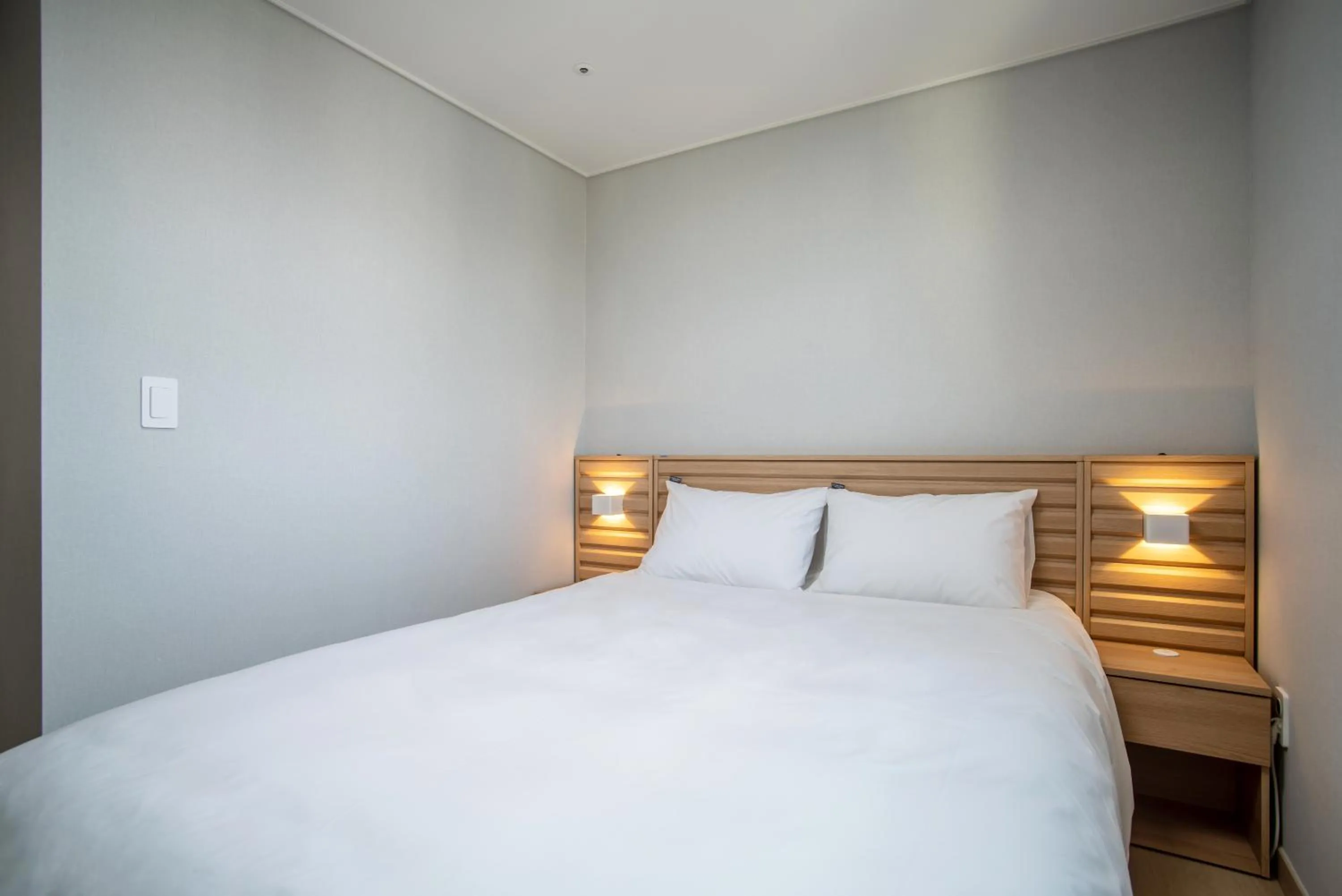 Bed in Jeju Central Park Residence