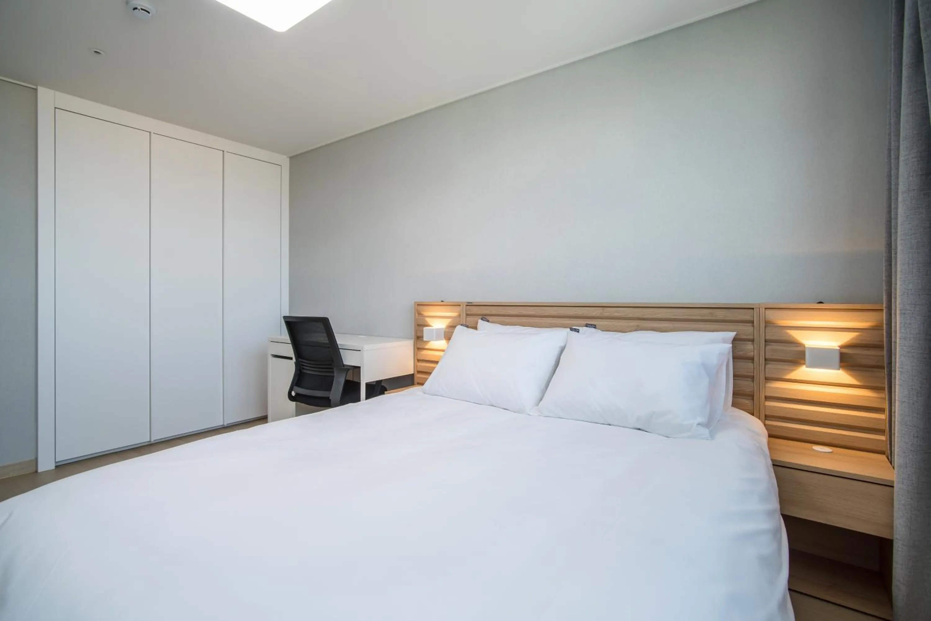 Bed in Jeju Central Park Residence