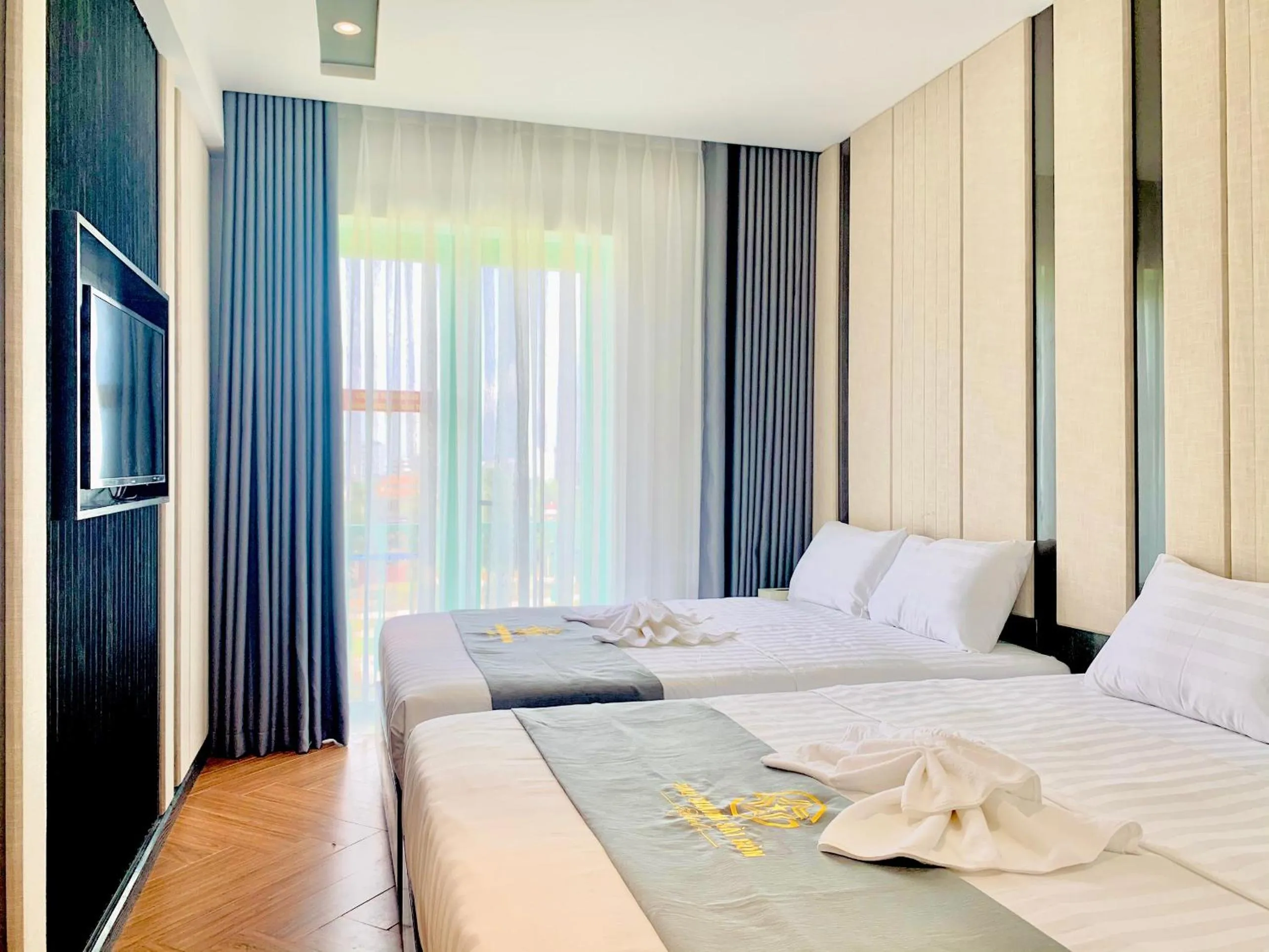 Bed in Sao Charm Sài Gòn Hotel