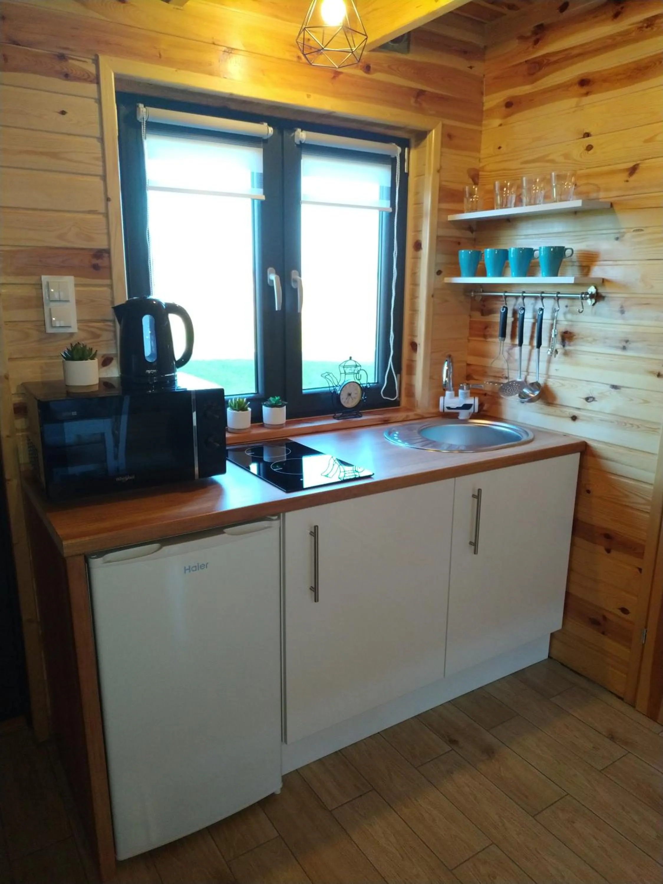 Kitchen or kitchenette in Domki Arkadia Mielno