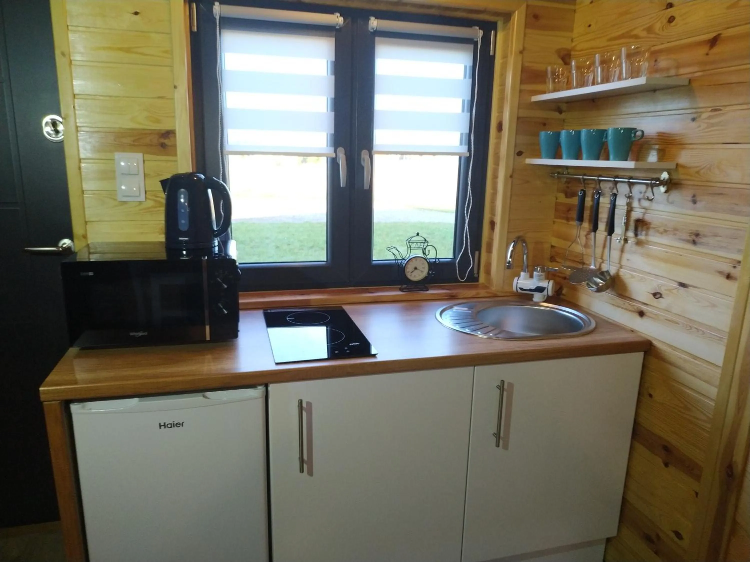 Kitchen or kitchenette in Domki Arkadia Mielno