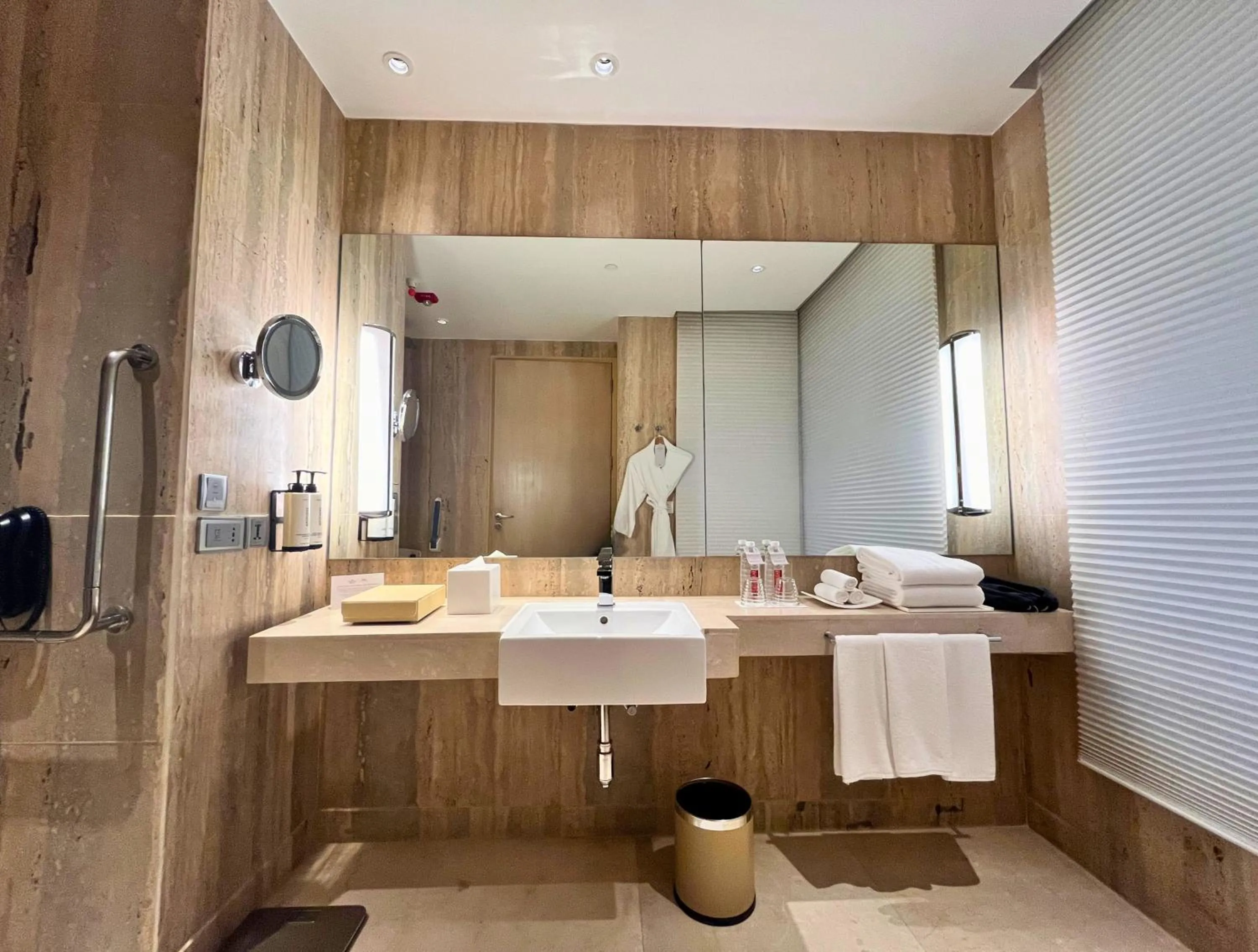 Bathroom in Crowne Plaza Greater Noida by IHG