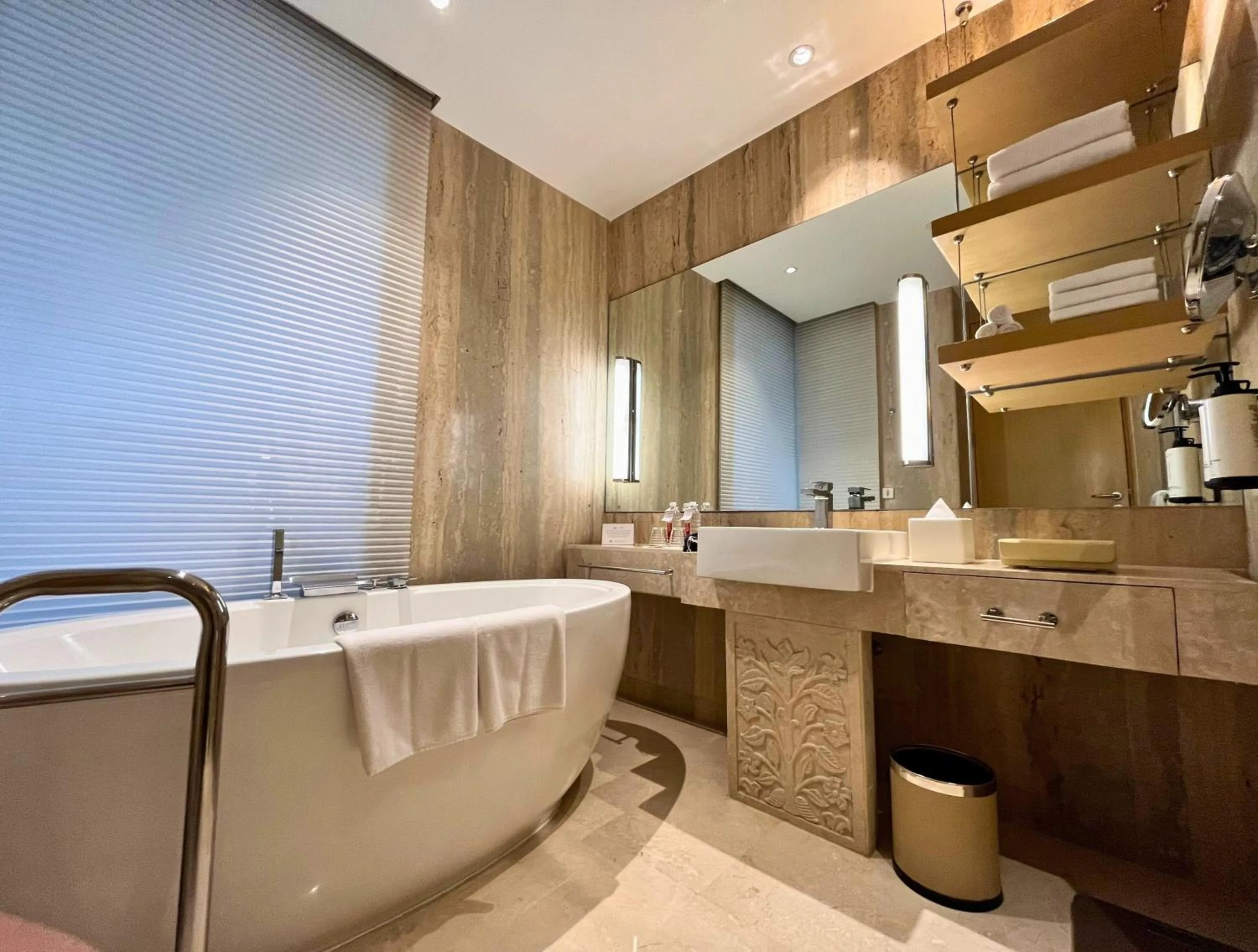 Bathroom in Crowne Plaza Greater Noida by IHG