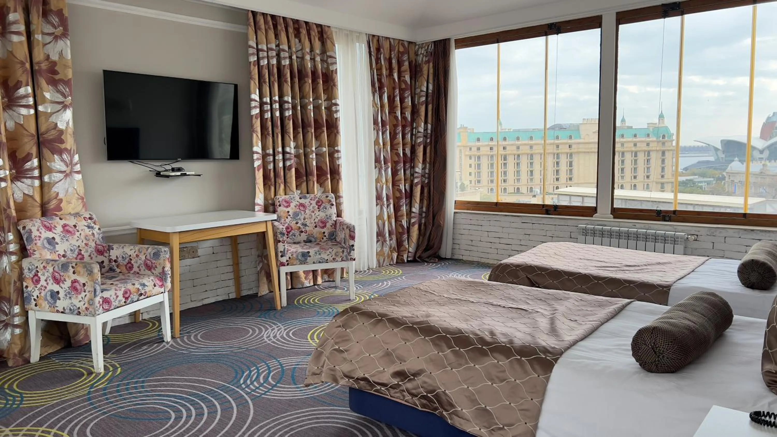 Communal lounge/ TV room, Bed in Qala Hotel