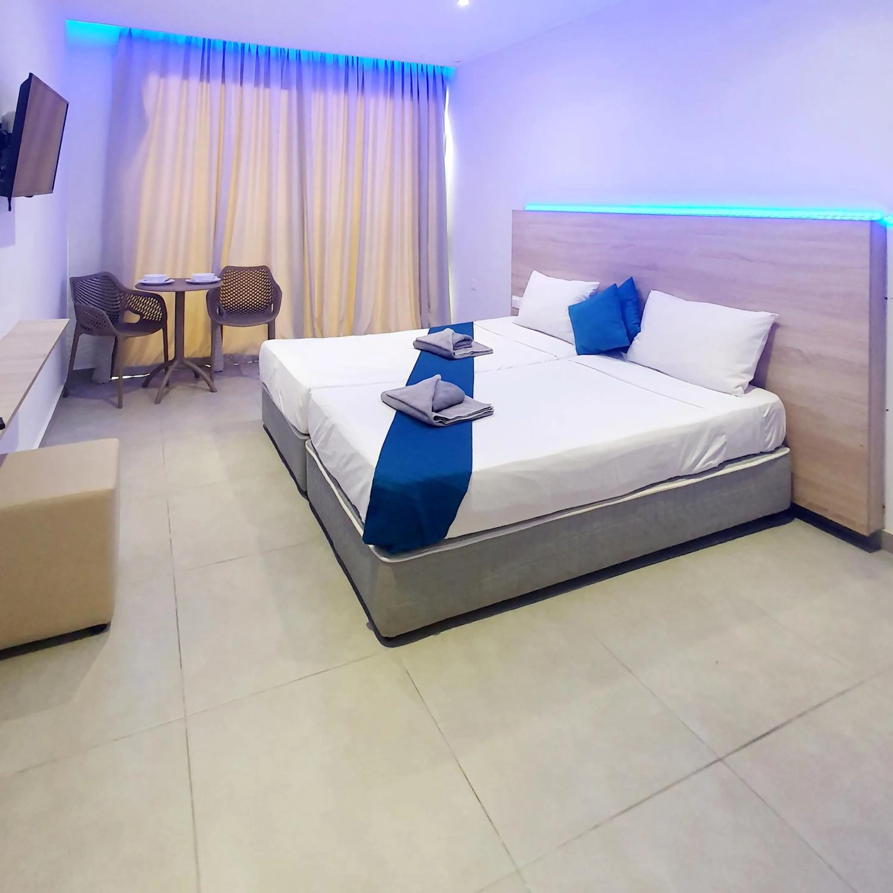 Bed in Sun Plaza Suites - Adults Only