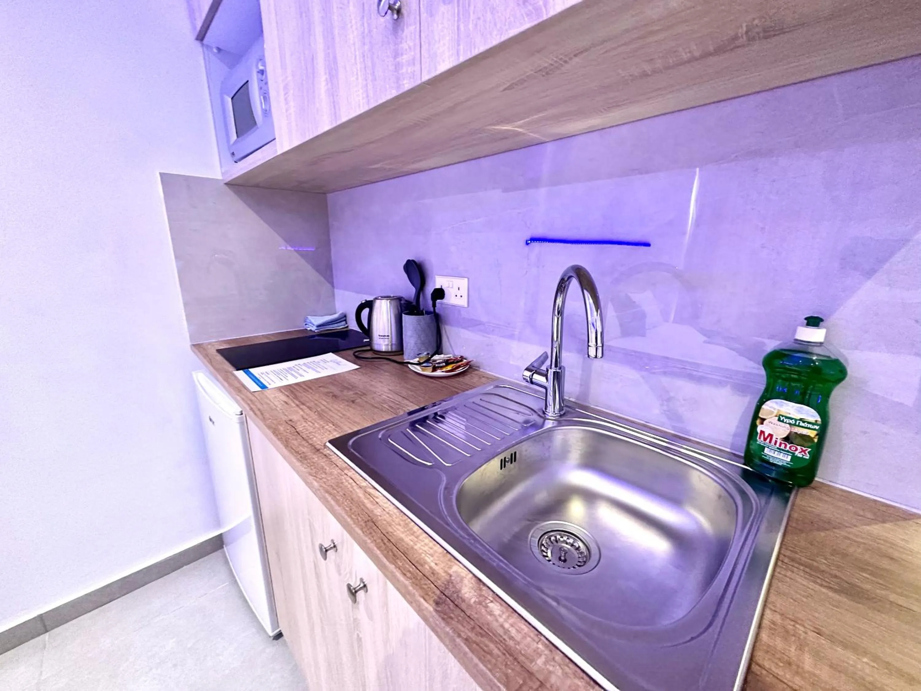 Kitchen or kitchenette in Sun Plaza Suites - Adults Only