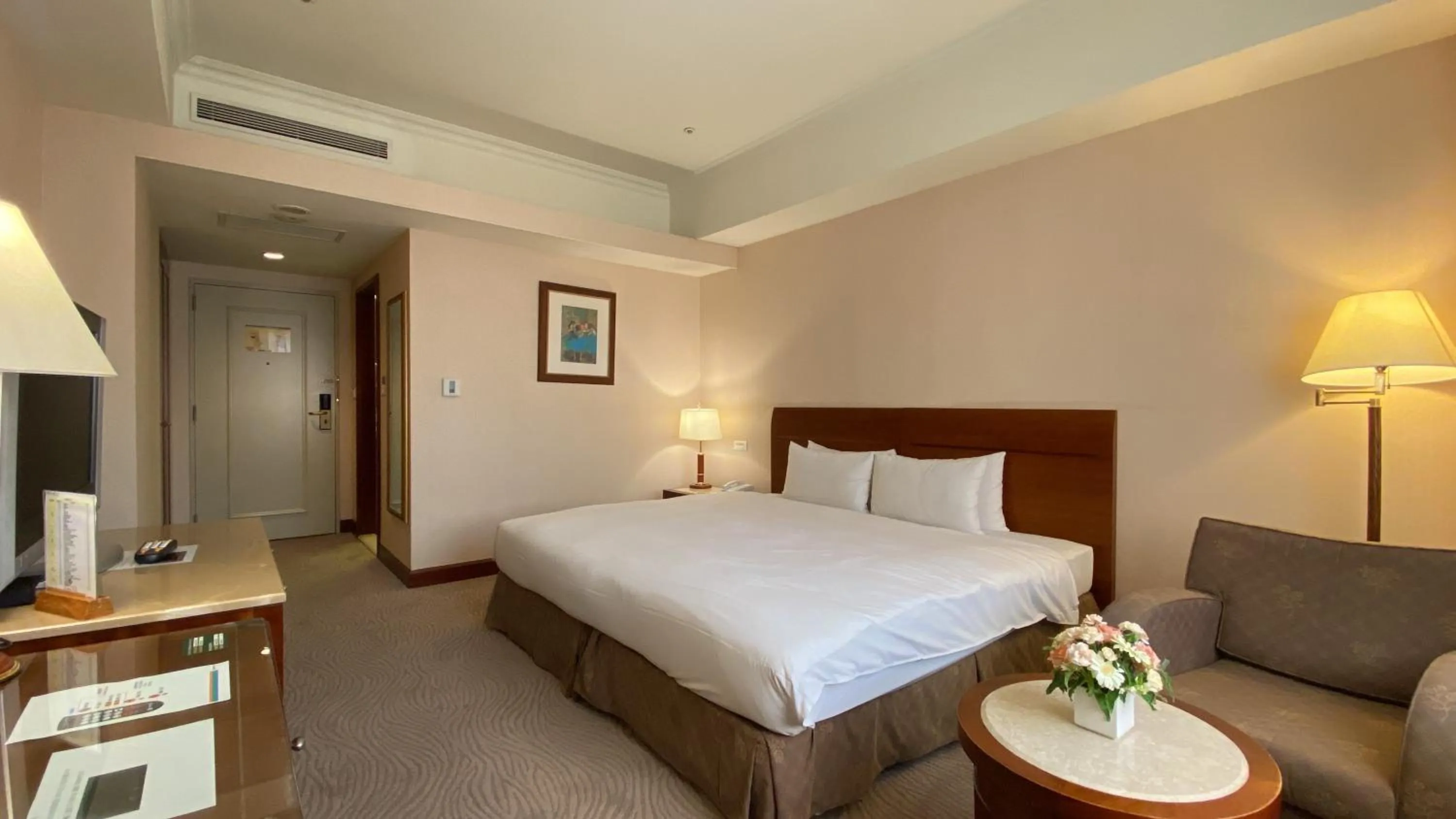 Bed in Monarch Plaza Hotel