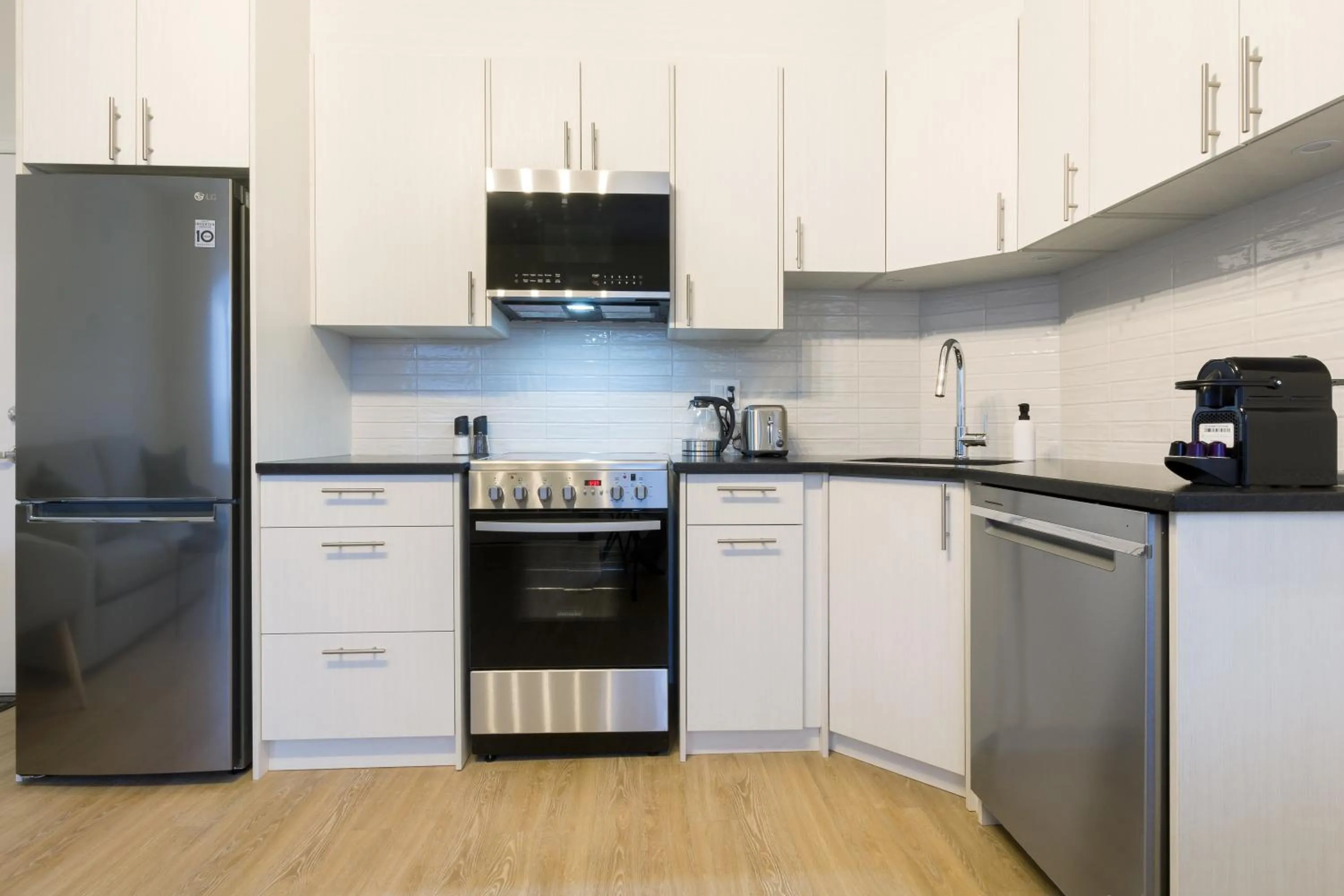 Kitchen or kitchenette in Appart hôtel Le Saint-Anselme