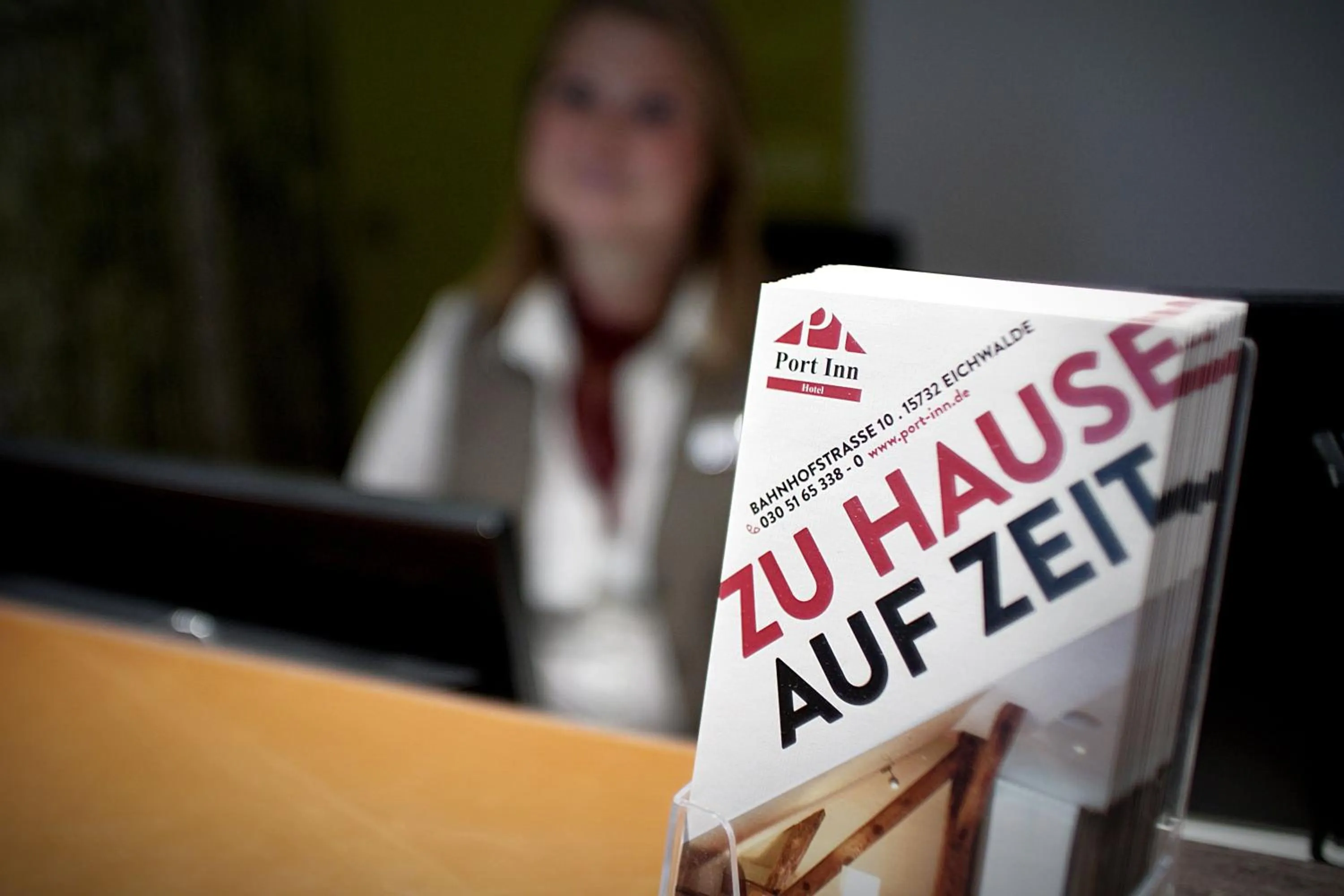 Property logo or sign in Port Inn Hotel