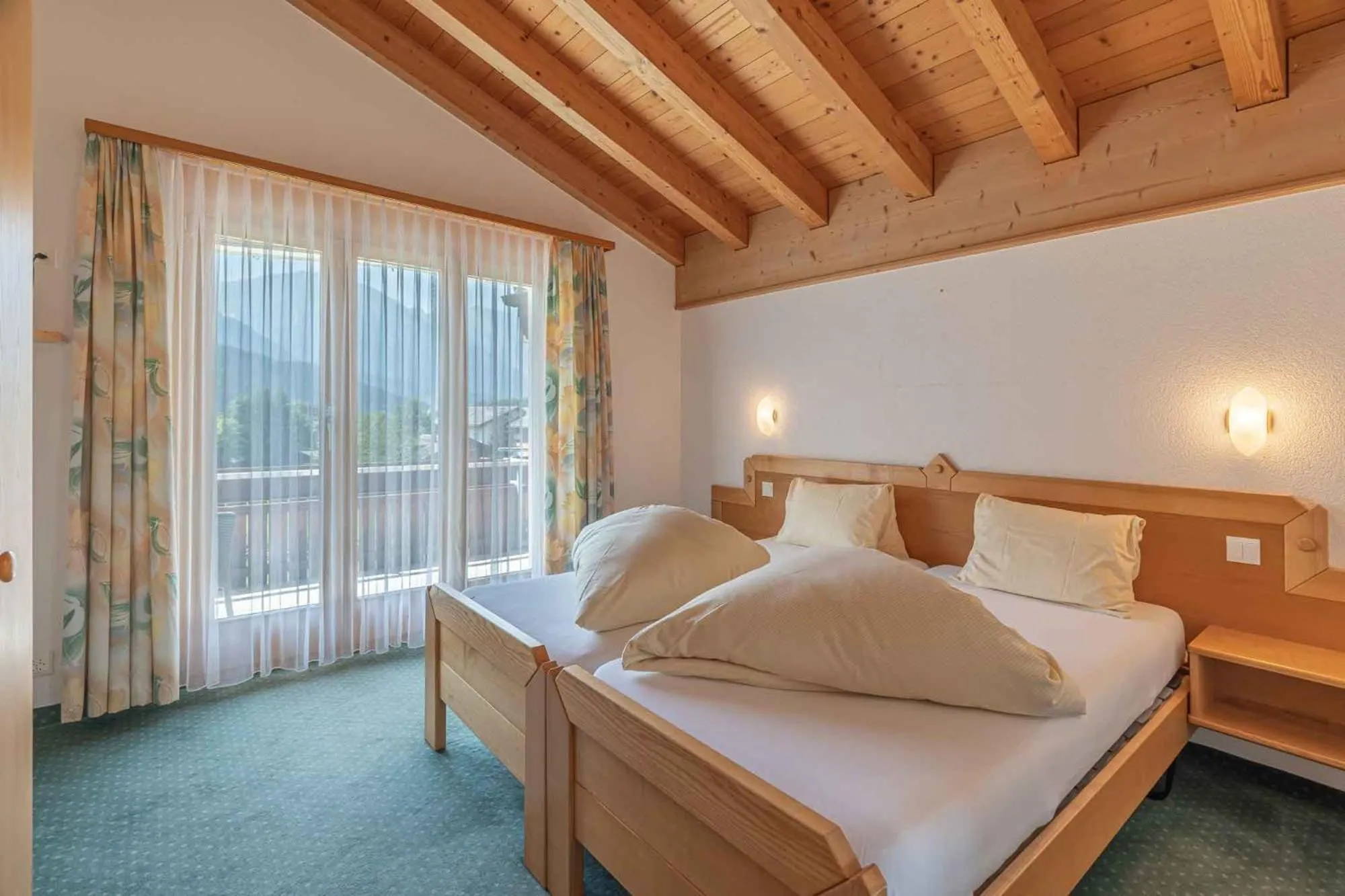 Photo of the whole room, Bed in Aktiv- und Genusshotel Alpenblick
