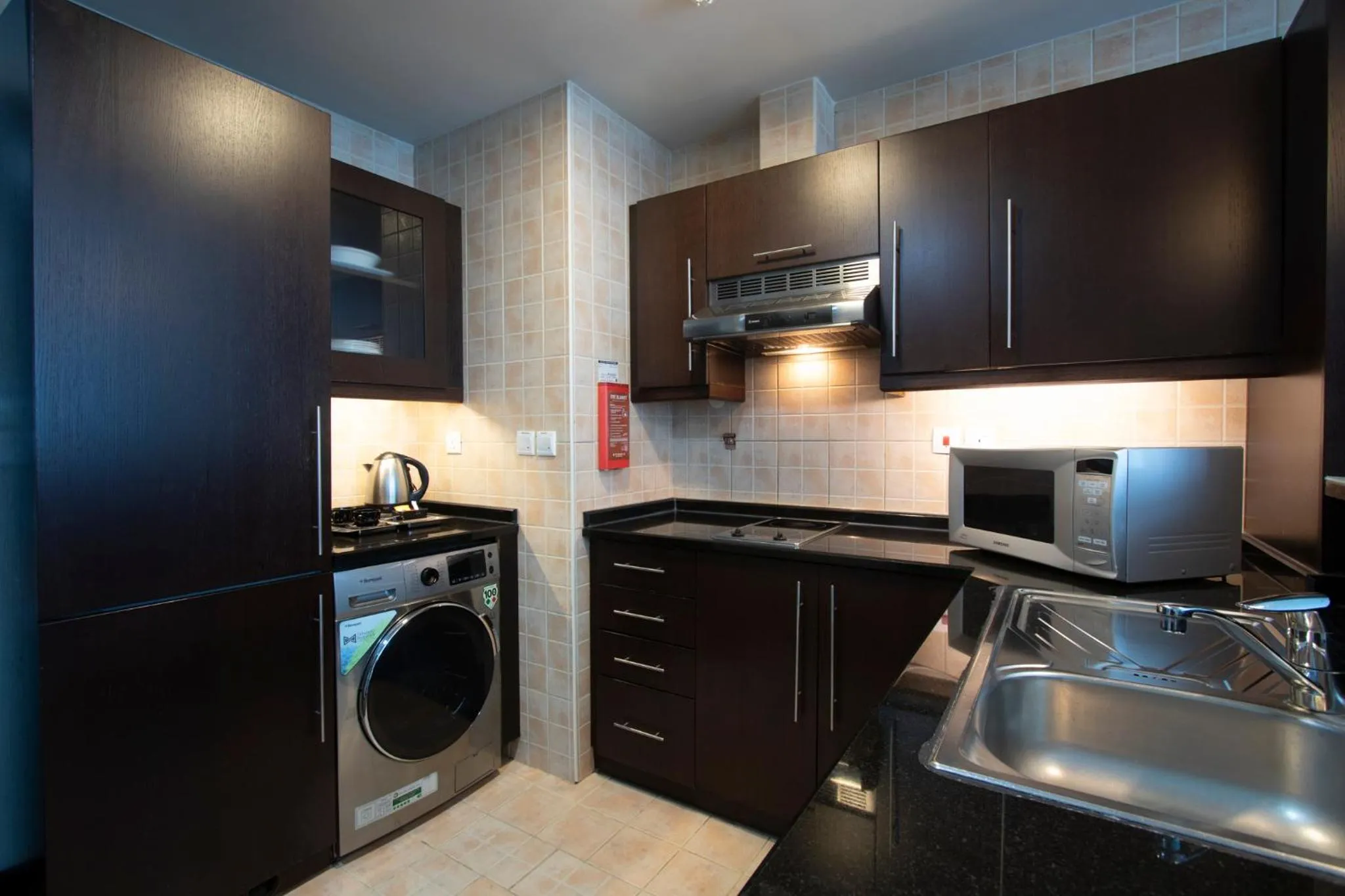 Kitchen or kitchenette in Al Manzel Hotel Apartments