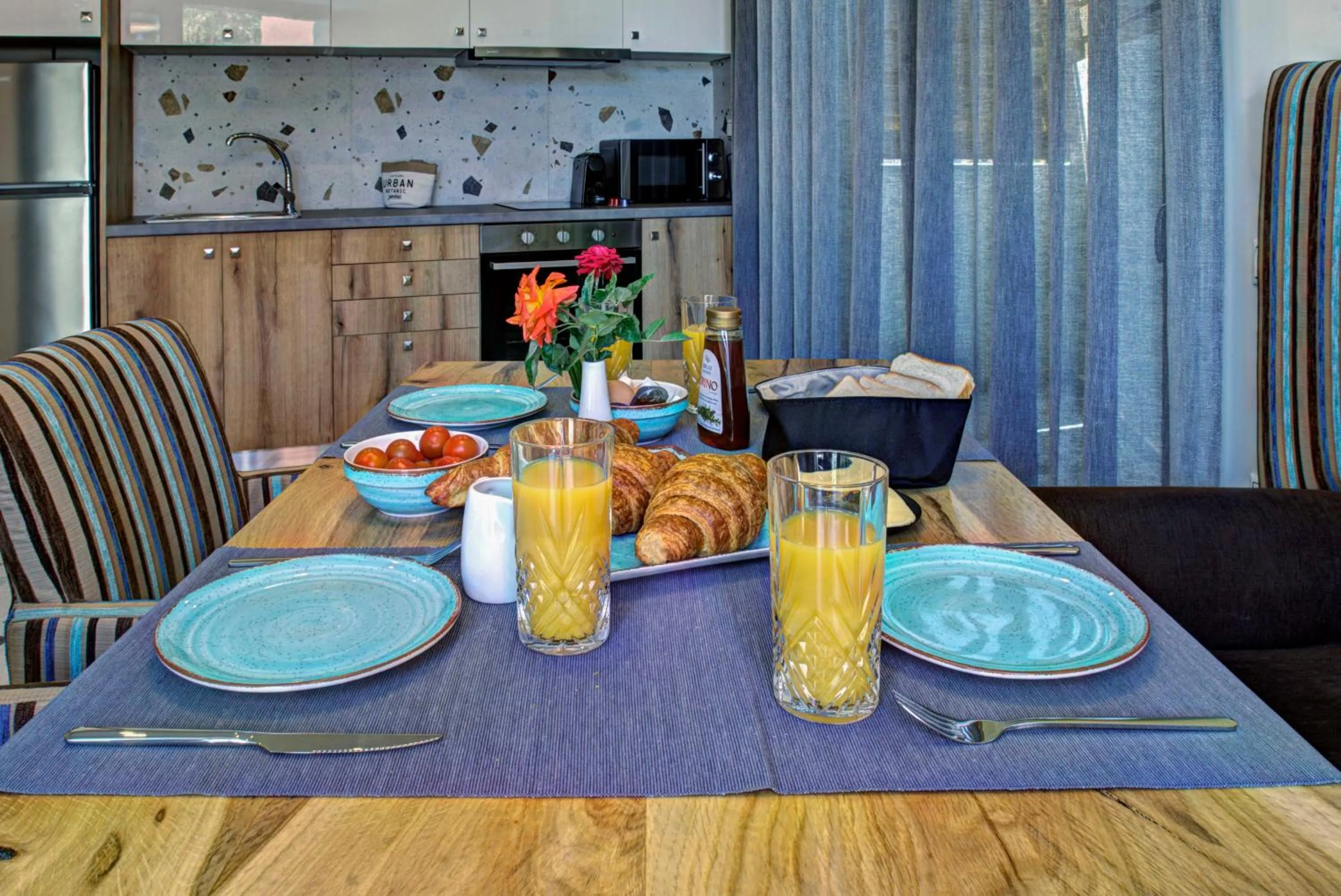 Dining area in Tessera Villas & Studios Collection