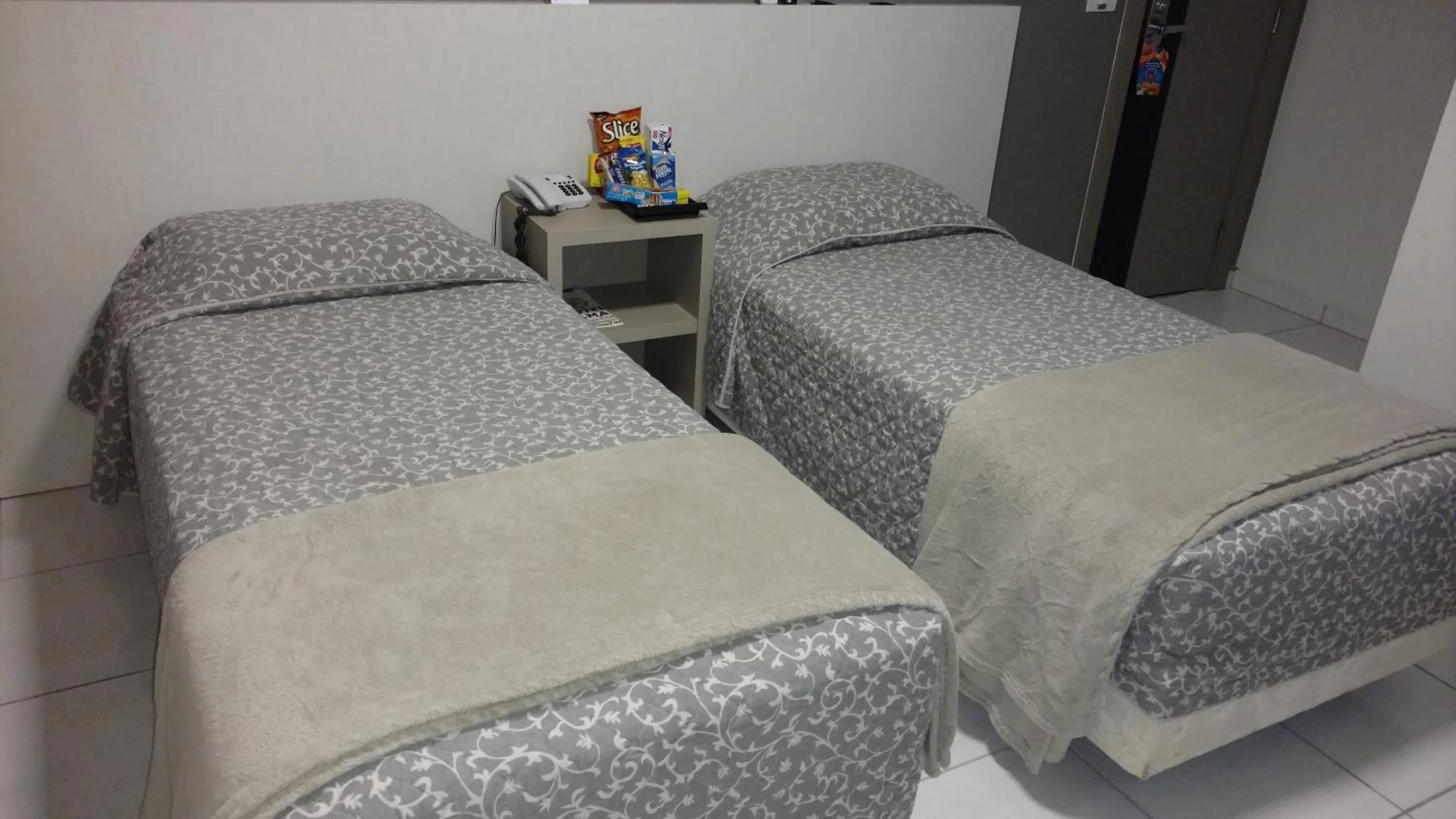 Bed in Hotel Palmas Executivo