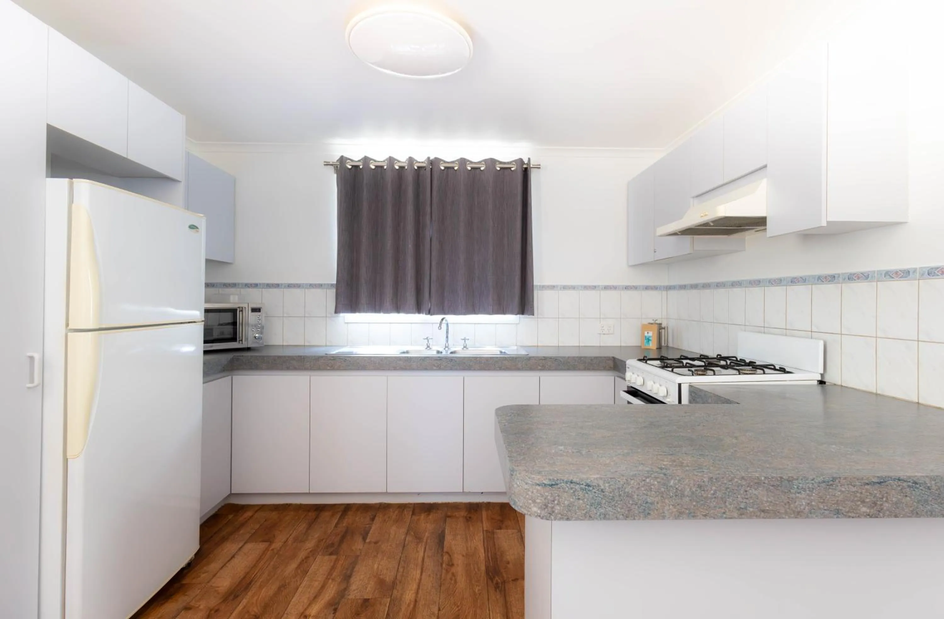 Kitchen or kitchenette in Ningaloo Caravan and Holiday Resort