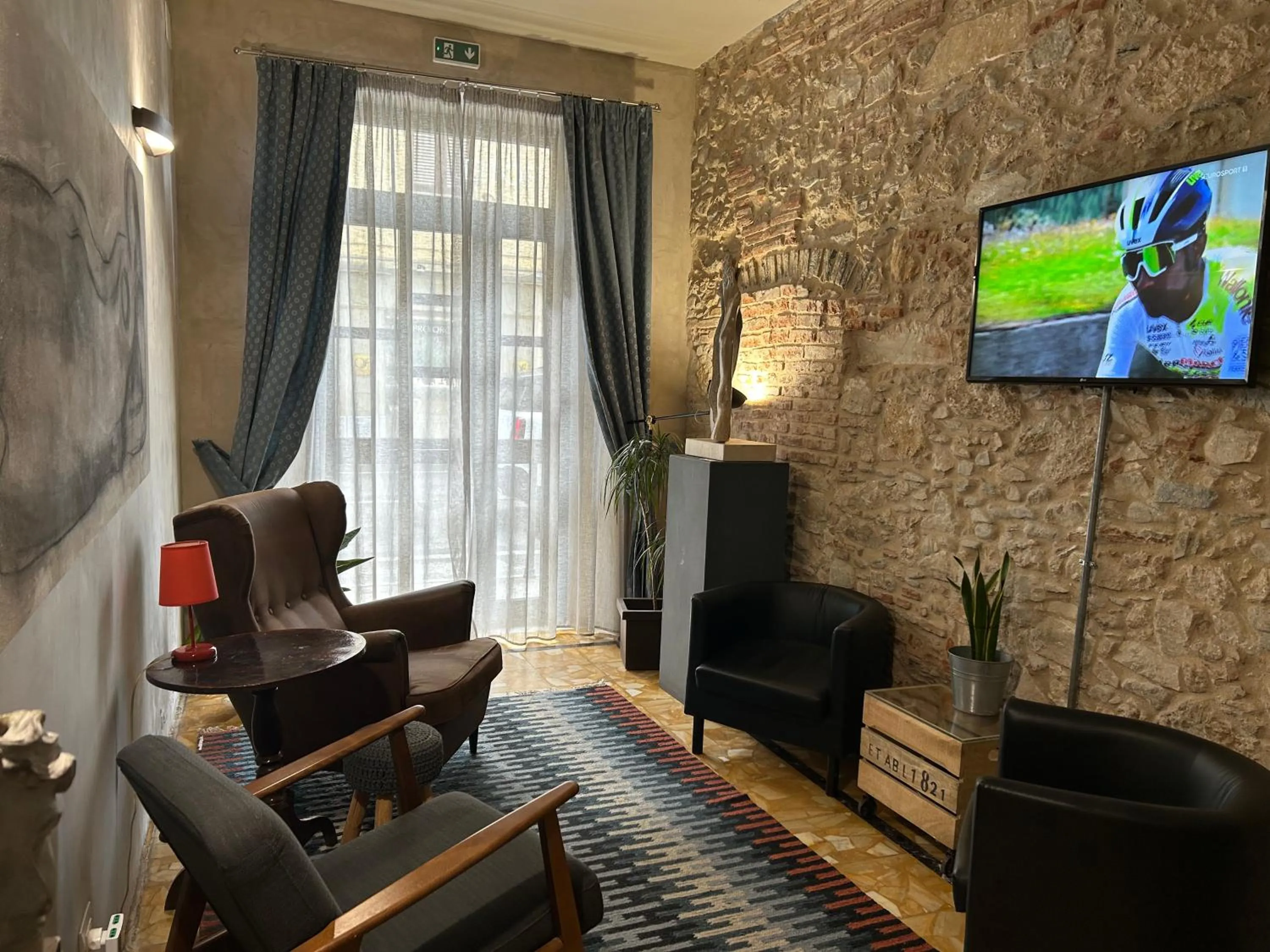 Communal lounge/ TV room in Art Hotel Pietrasanta