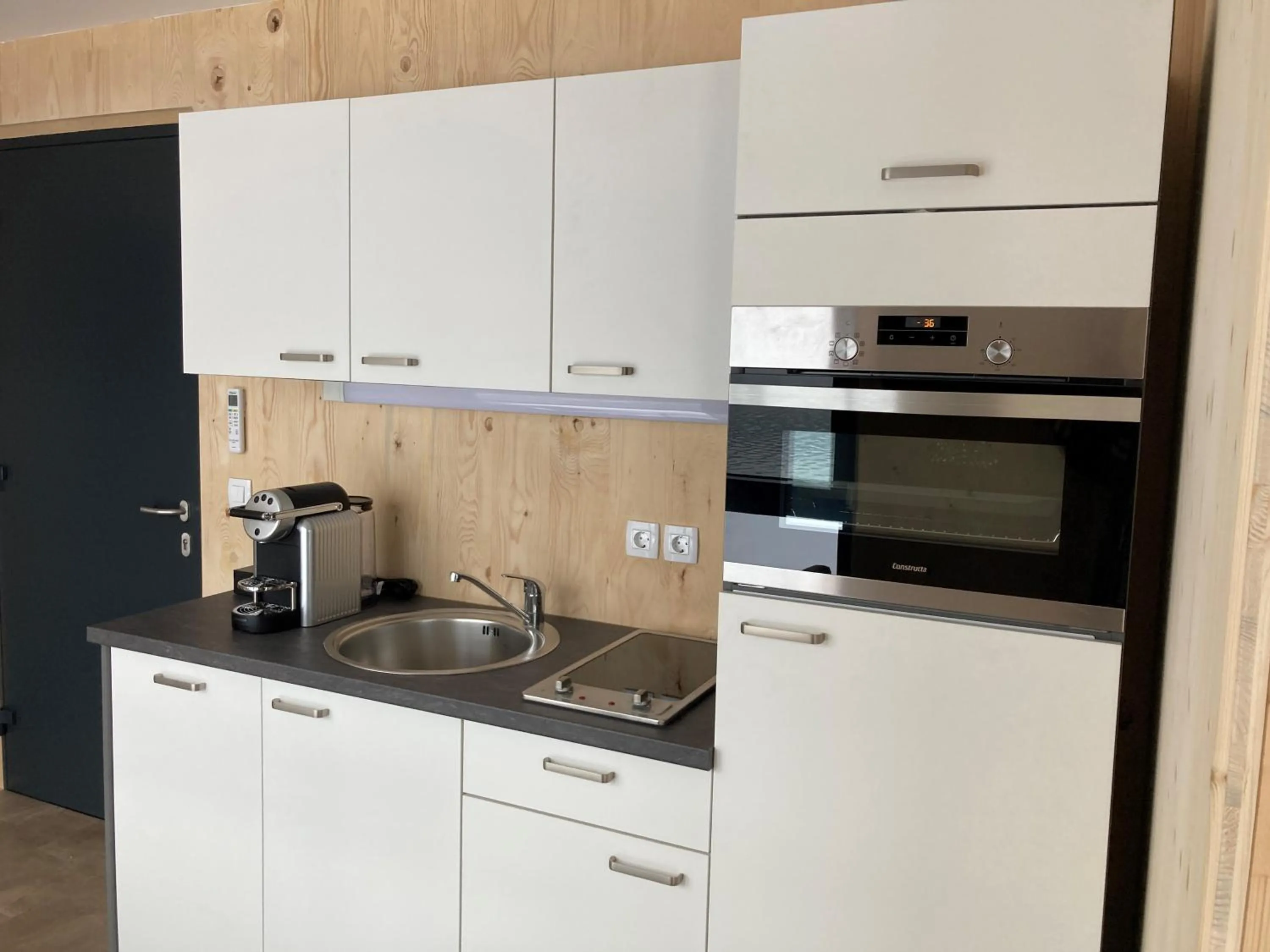 Kitchen or kitchenette in Kantor Village am Millstätter See - Boutique-Chalets und Lodges