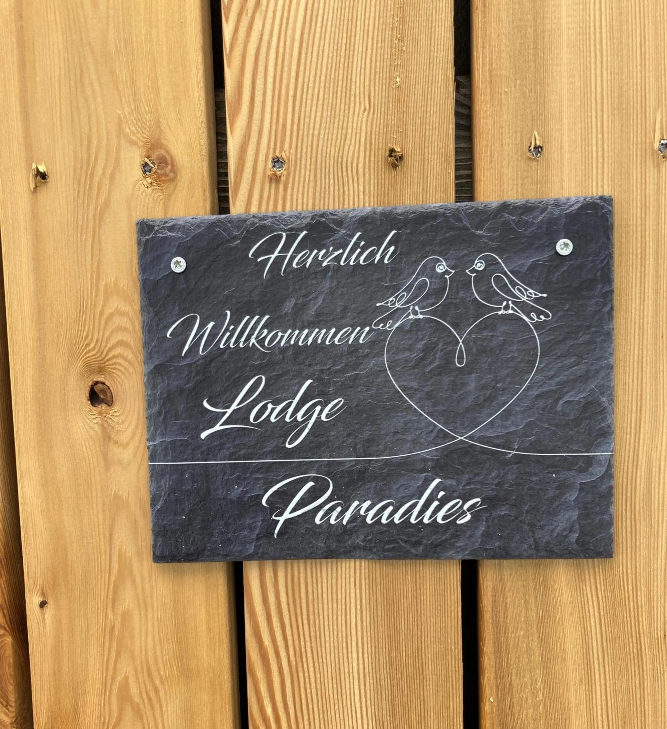 Property logo or sign in Kantor Village am Millstätter See - Boutique-Chalets und Lodges