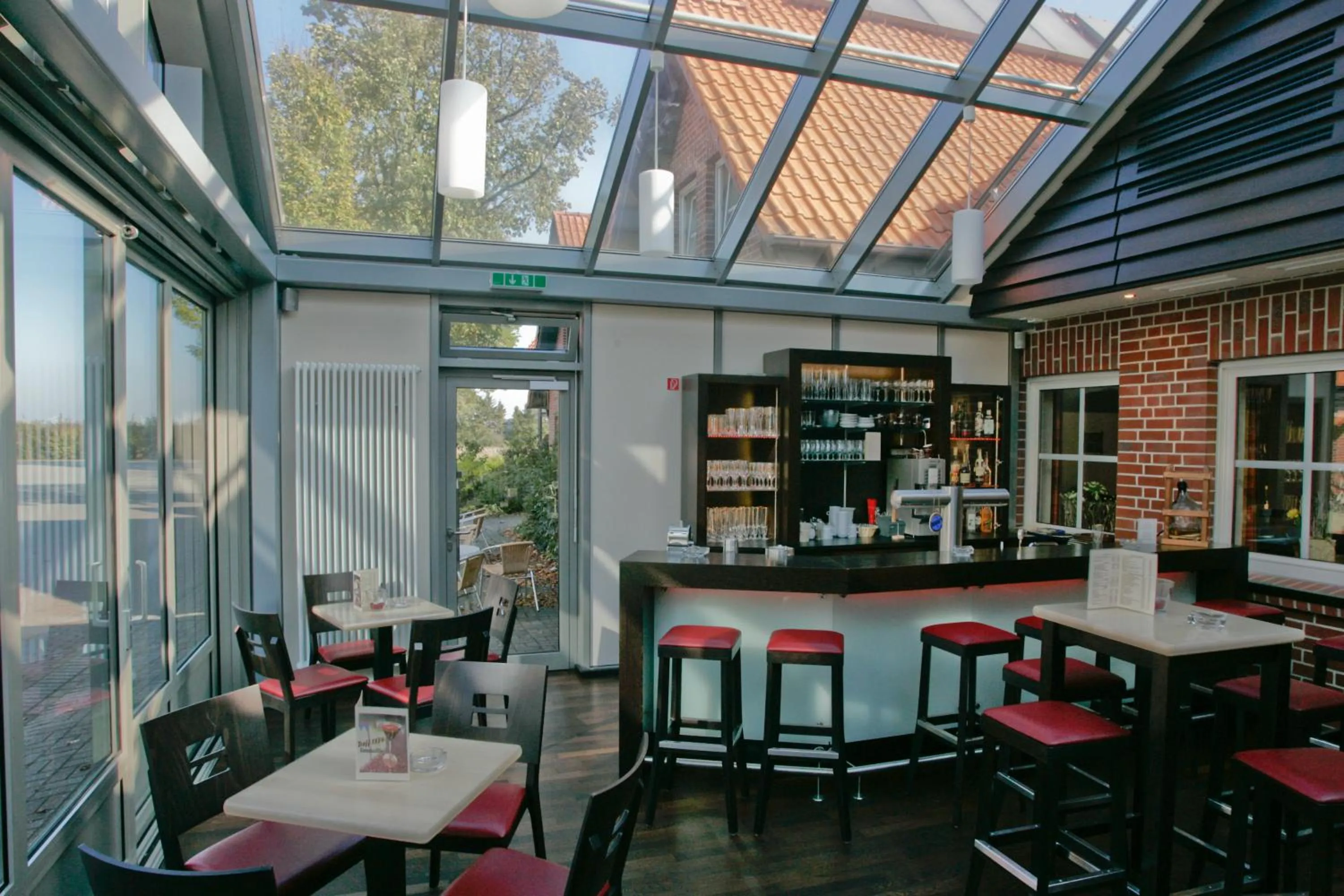 Communal lounge/ TV room in Landhotel Hermannshöhe