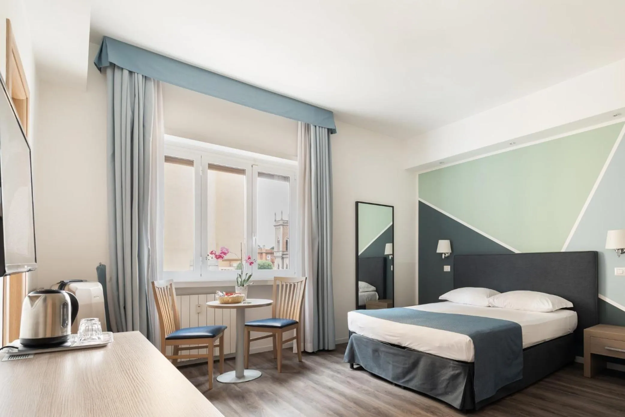 Bed in Fleming Suites by Hili