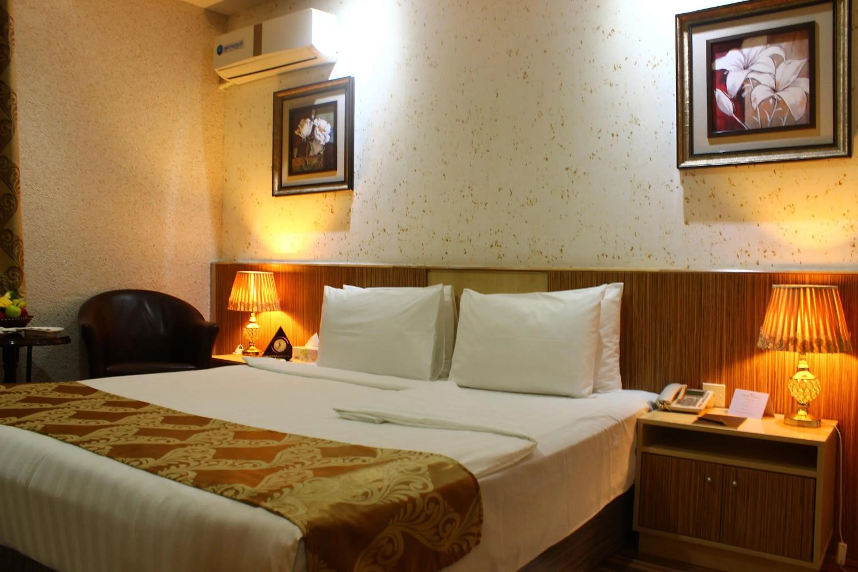 Bed in Palm Hotel