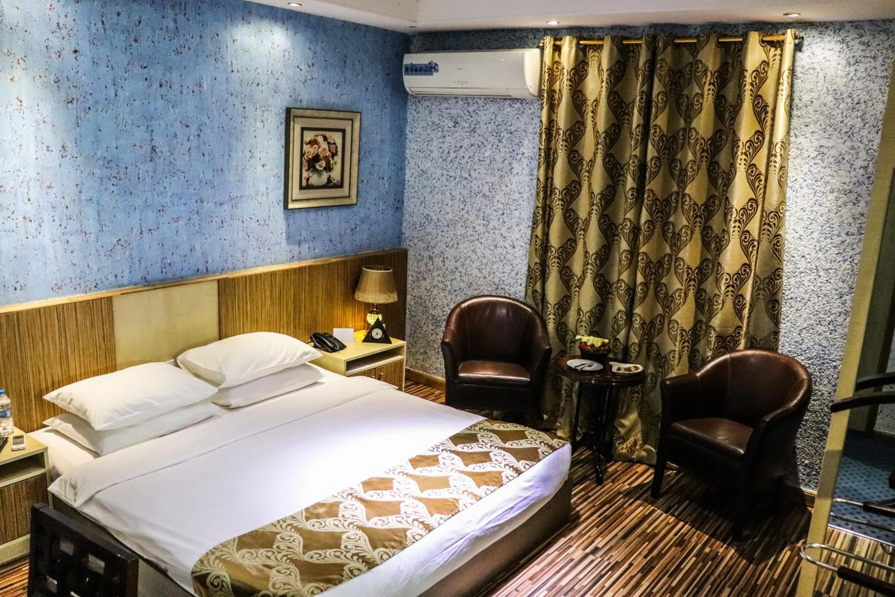 Bed in Palm Hotel