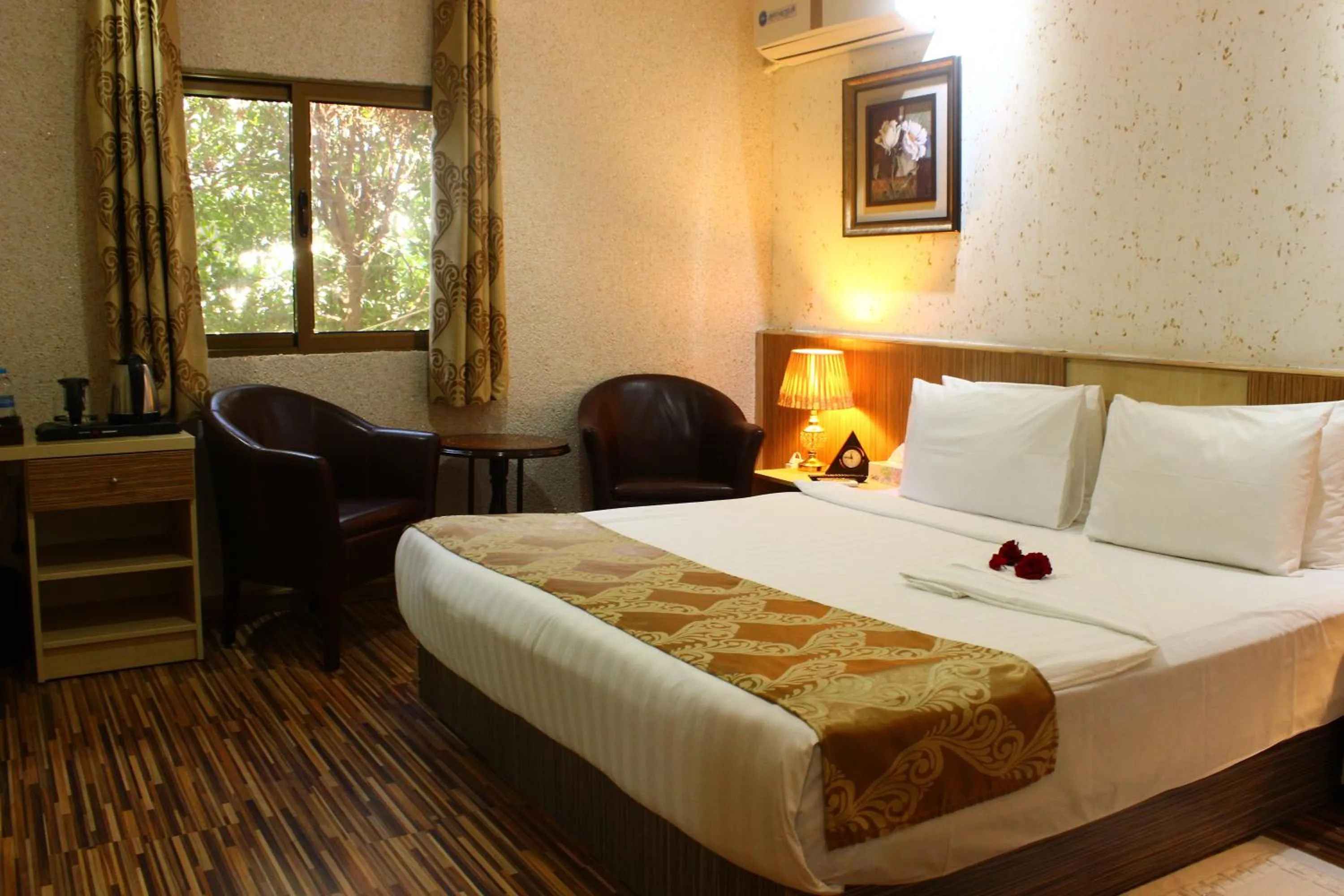 Bed in Palm Hotel