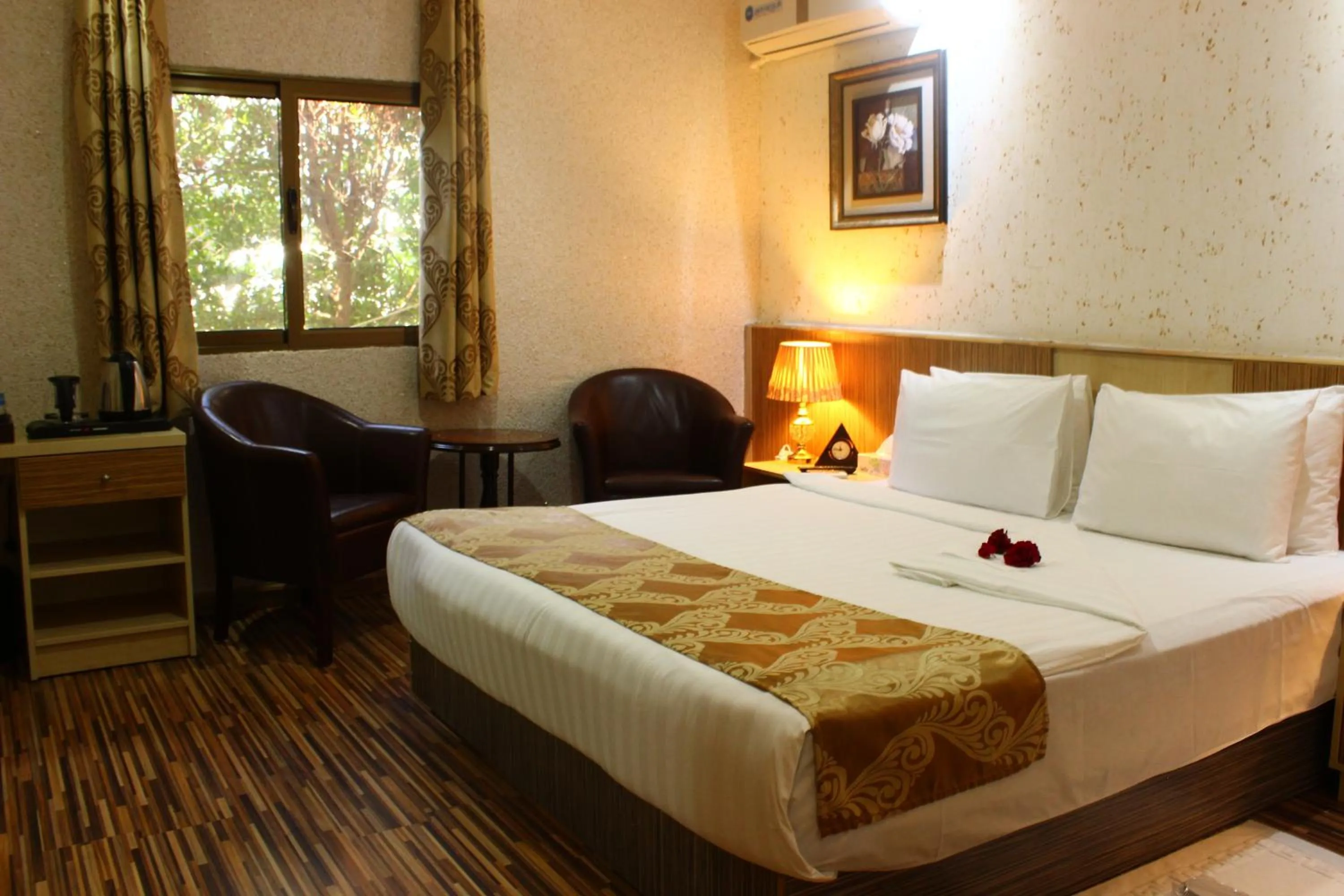 Bed in Palm Hotel