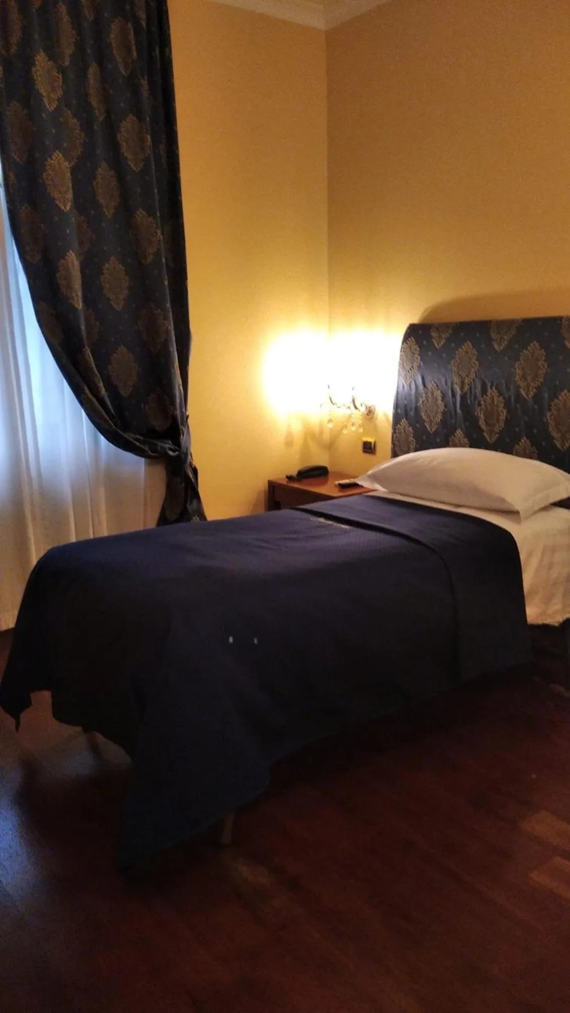 Bed in CANELLA HOTEL