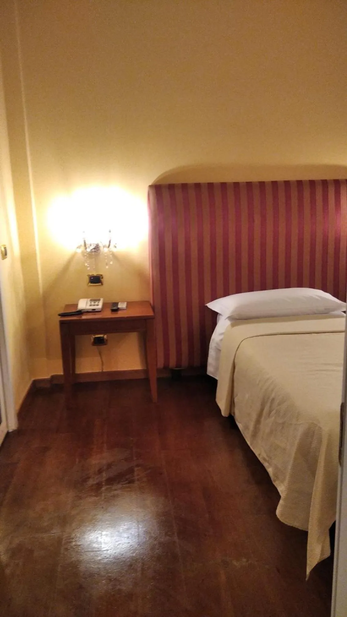 Bed in CANELLA HOTEL