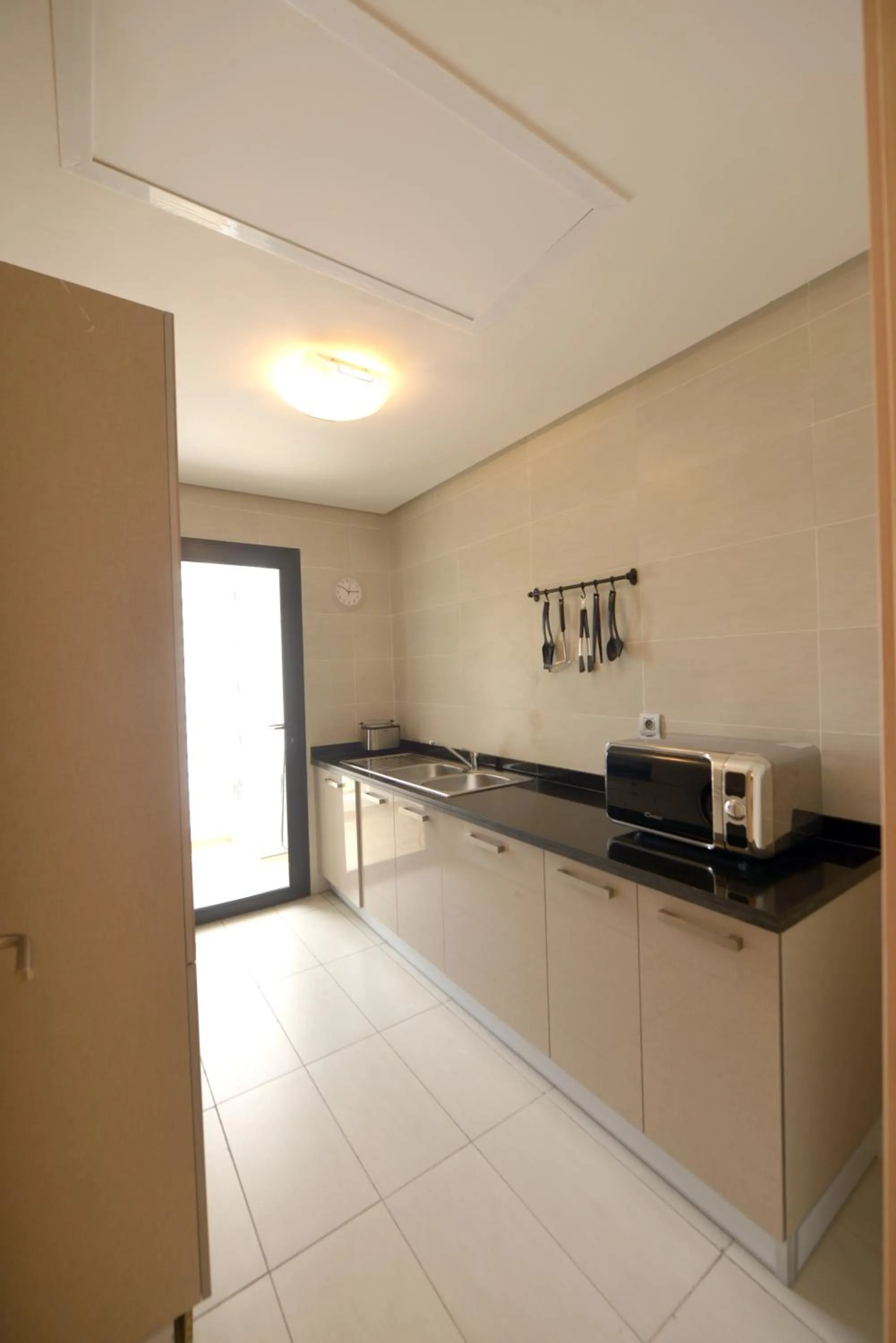Kitchen or kitchenette in Prestigia Rabat Hay Riad Premium Apartments