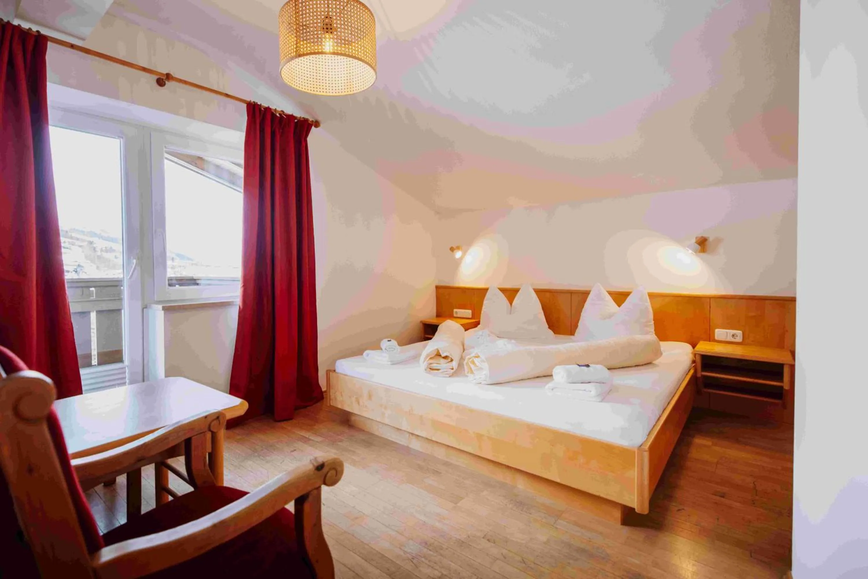 Bed in Hotel in the HEART of the Alps