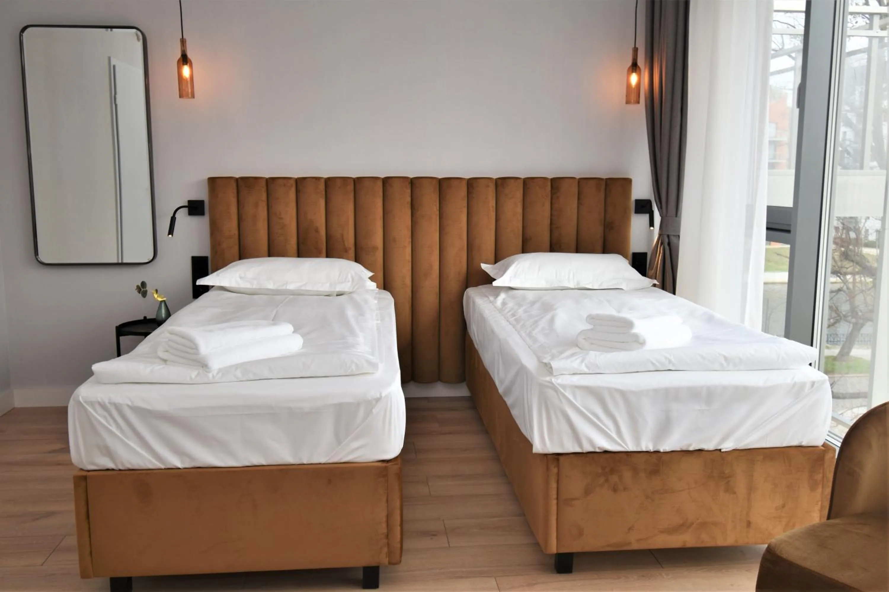 Bed in Patio Riverfront Aparthotel