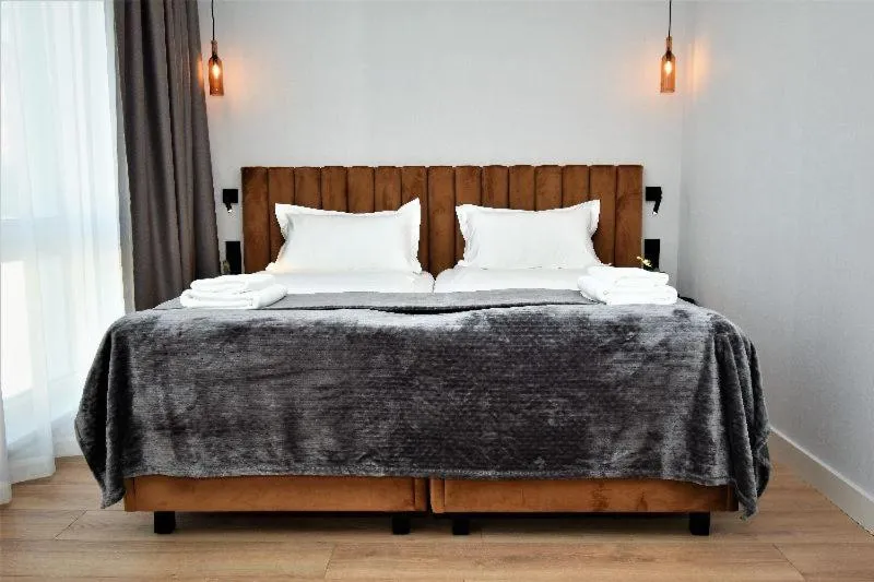 Bed in Patio Riverfront Aparthotel