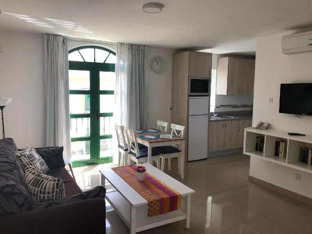 Living room in Billy's Puerto de Mogán Apartments by LIVVO