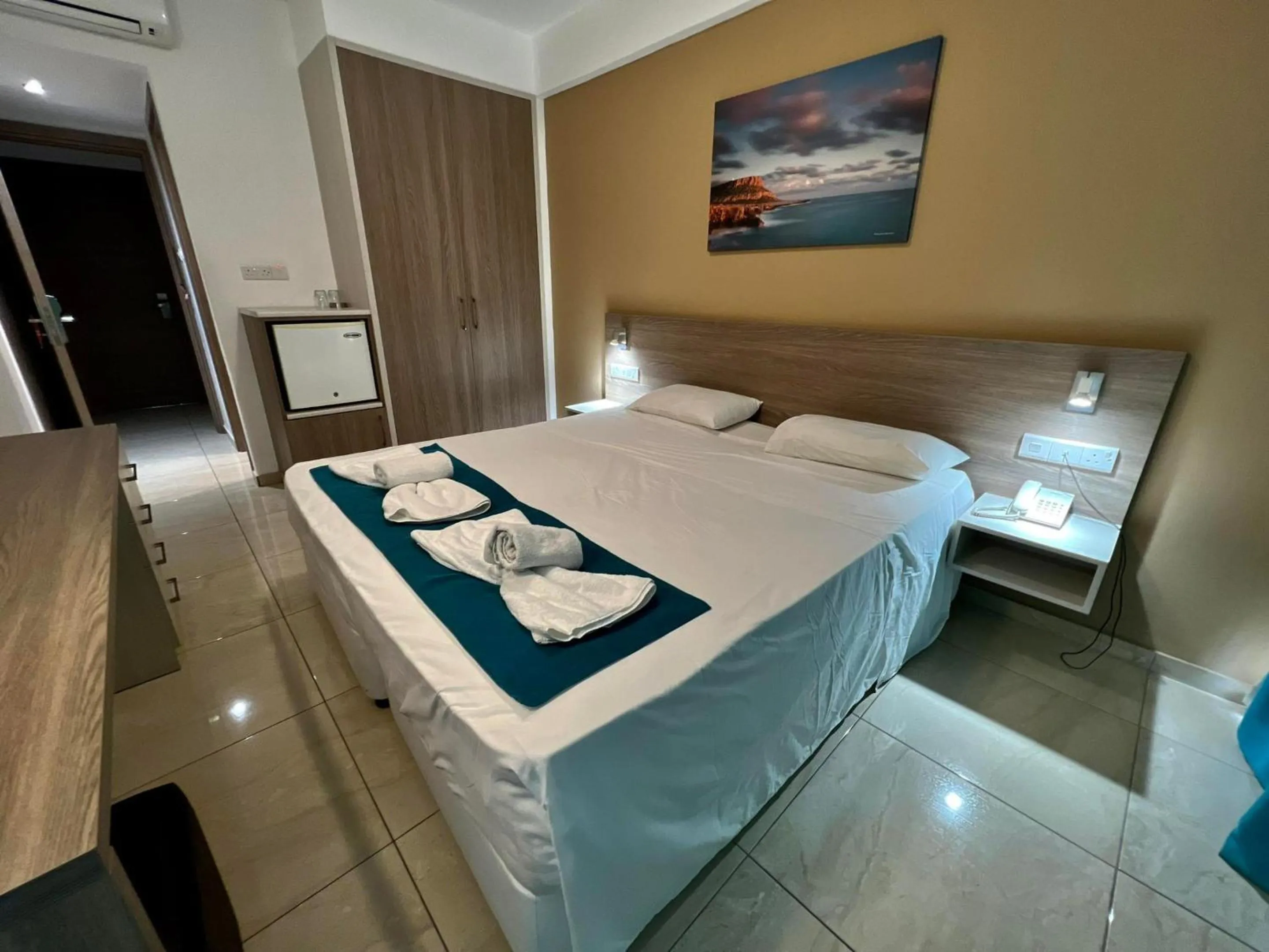 Bed in Sunny Blue Hotel