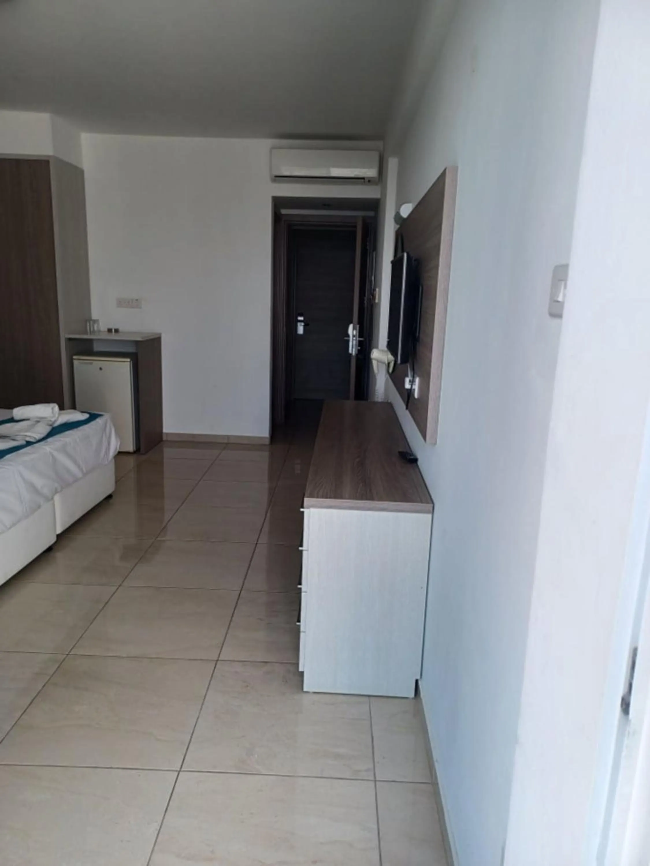 Bed in Sunny Blue Hotel