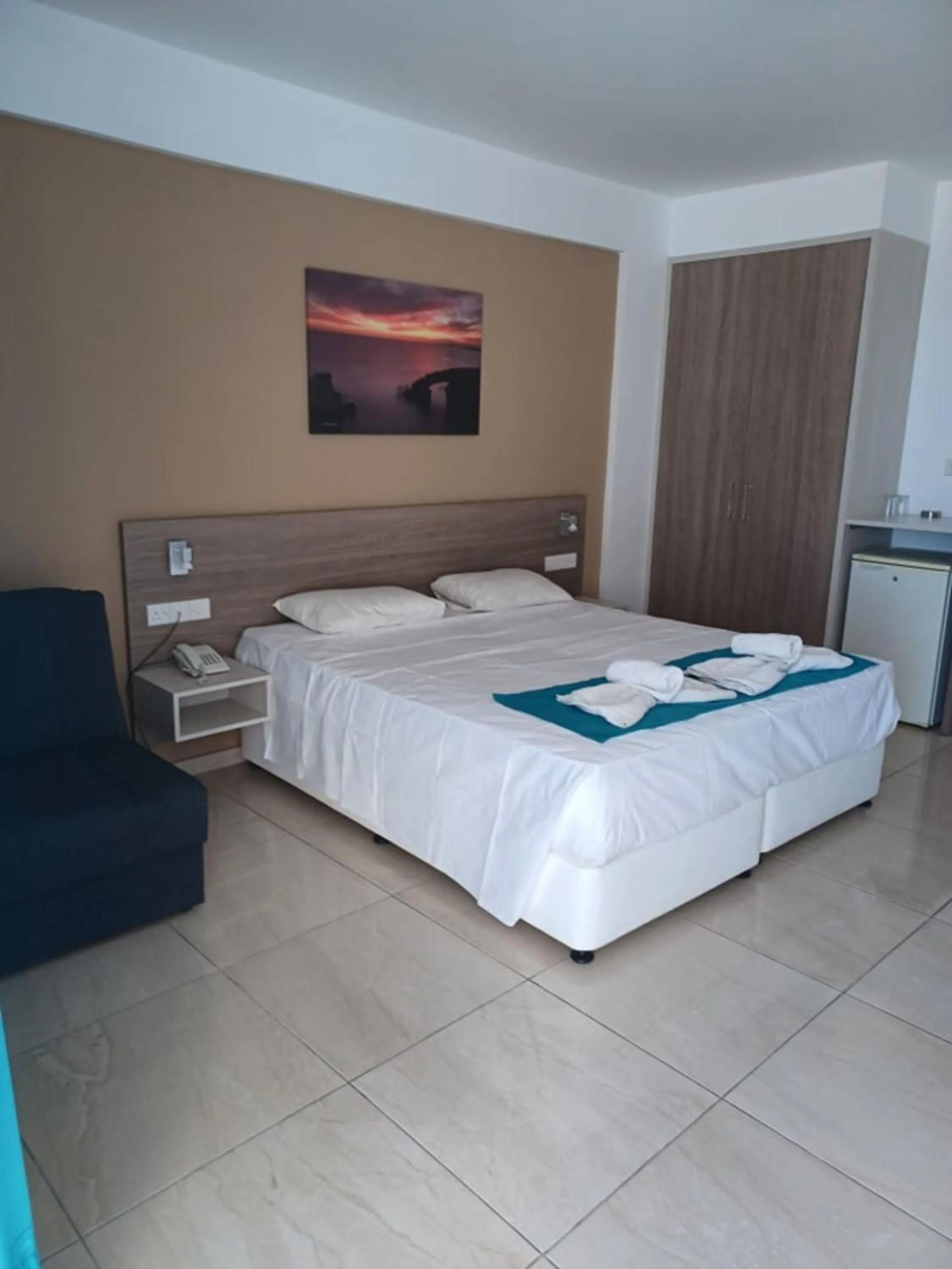 Bed in Sunny Blue Hotel