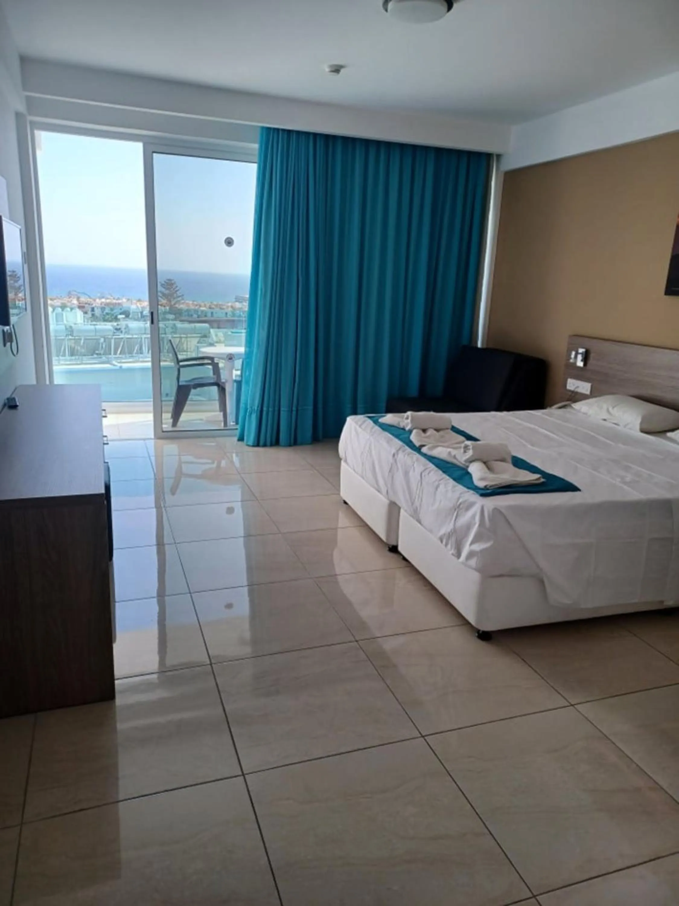 Bed in Sunny Blue Hotel