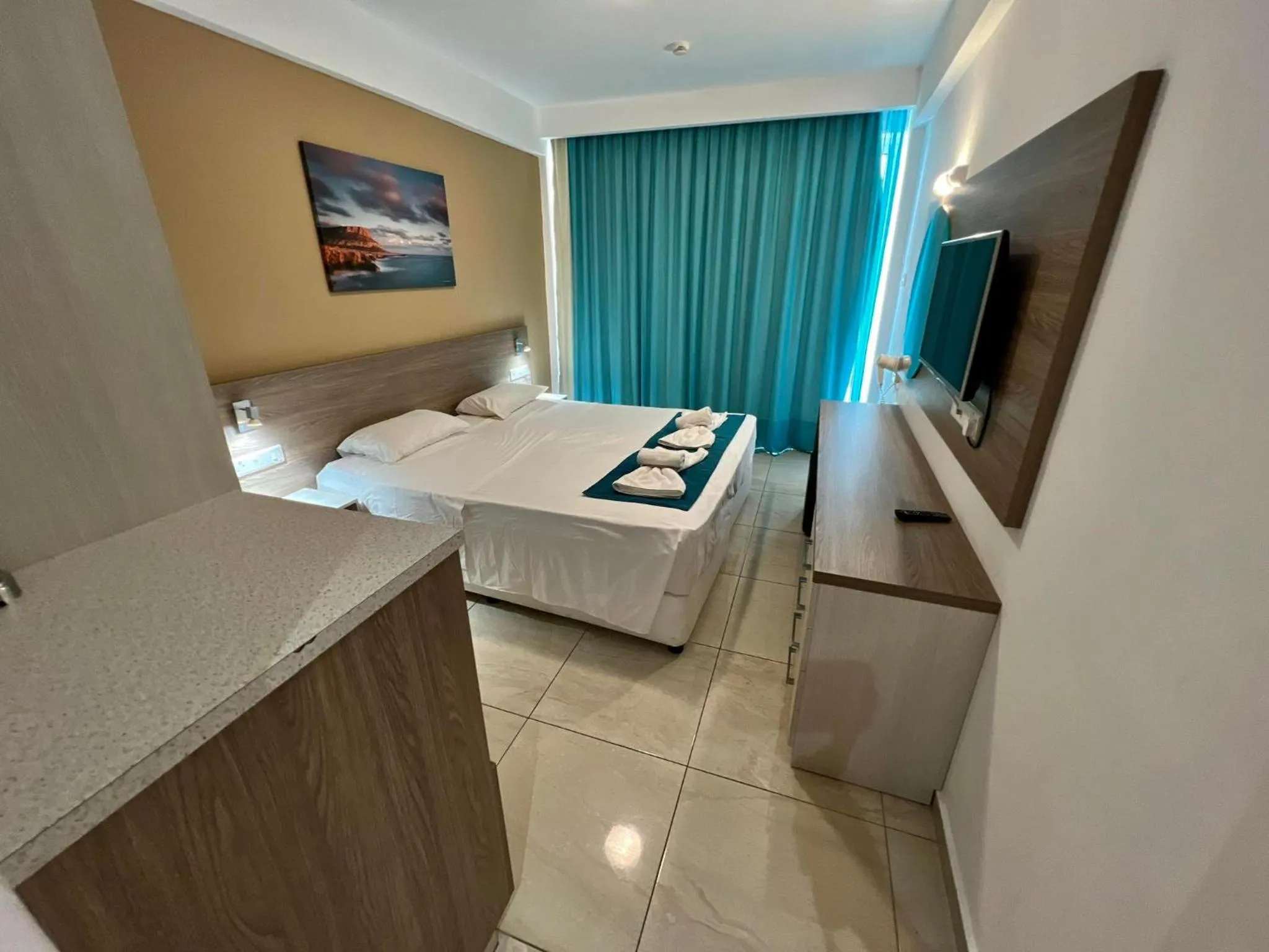 Bed in Sunny Blue Hotel