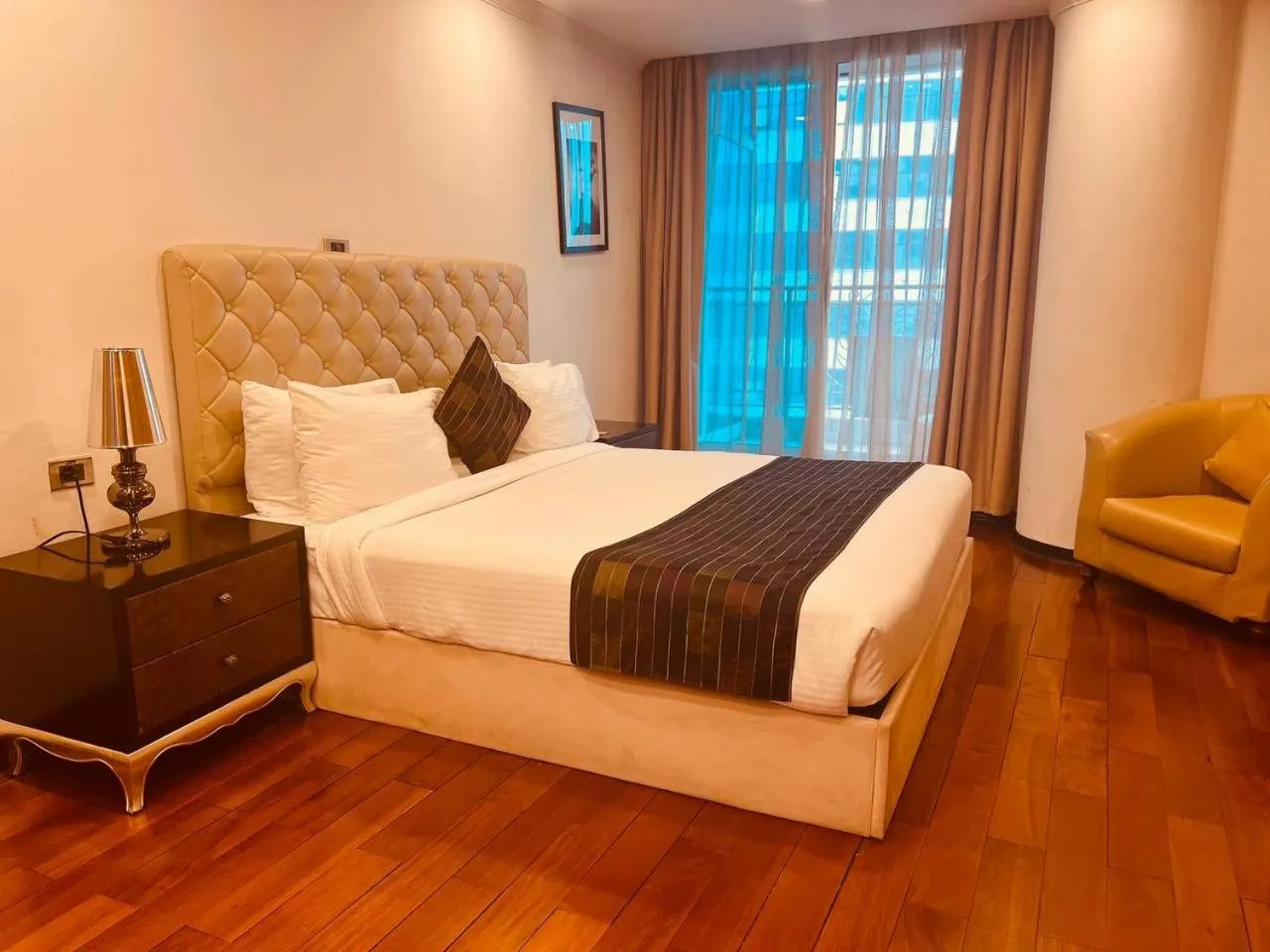 Seating area, Bed in Inter Luxury Hotel